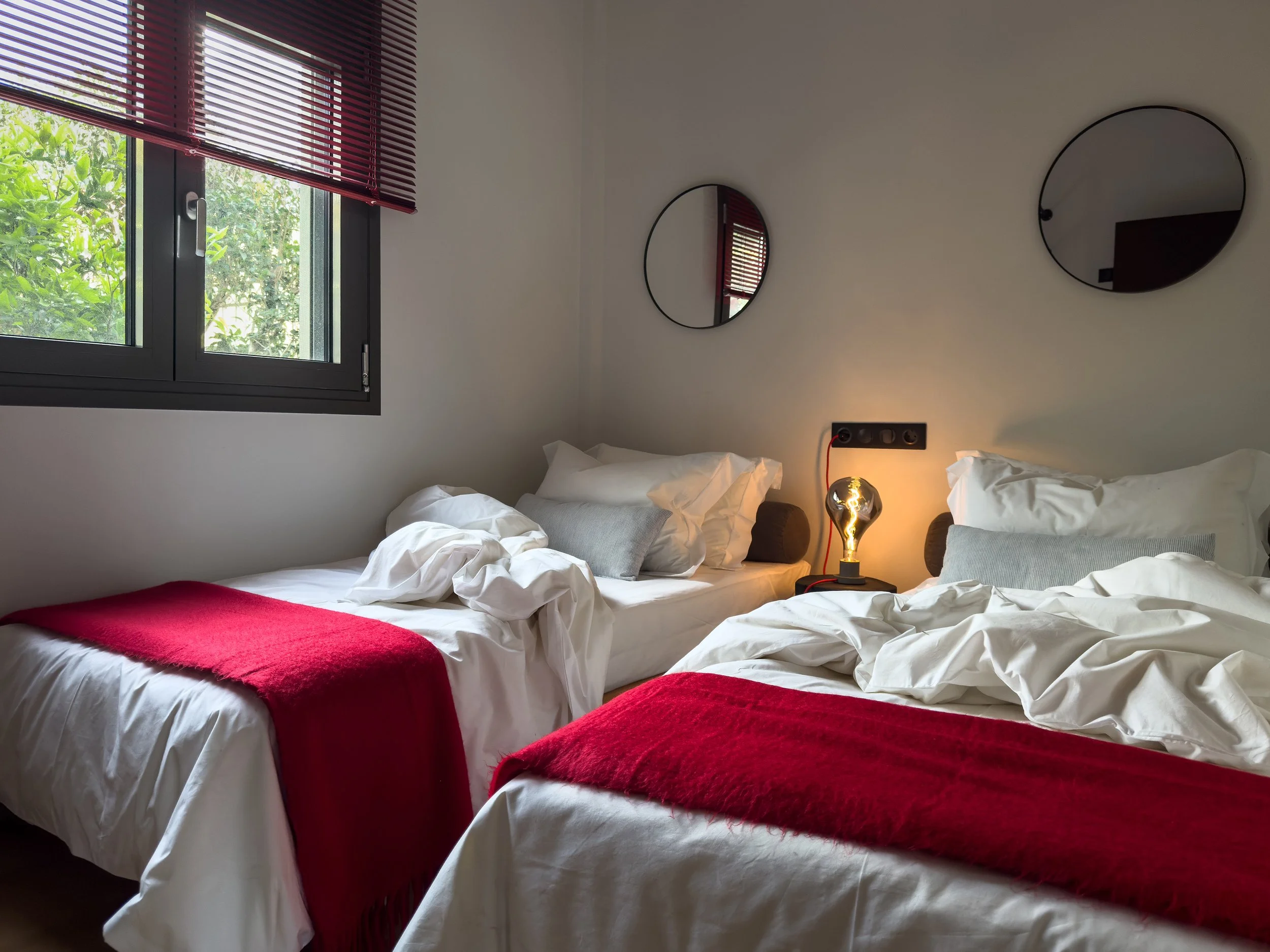 Bedroom spaces shaped by softness, warmth and the rhythm of slow living at Astraea Villa.