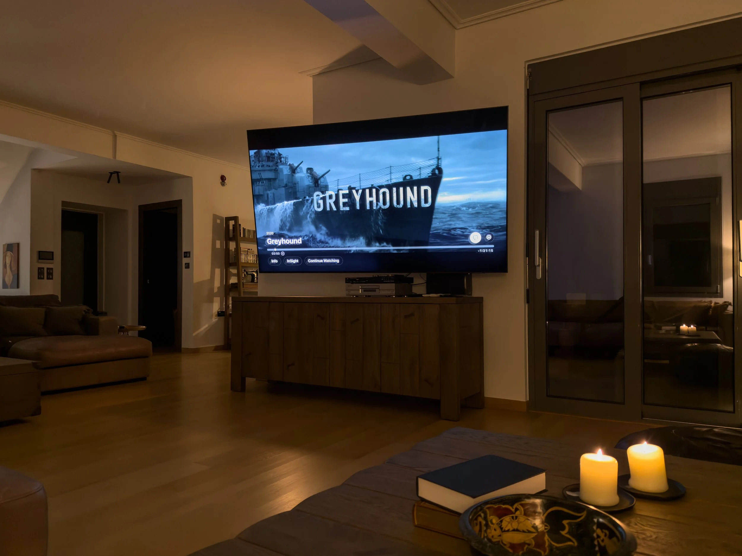 Warm living interiors with cinematic atmosphere at Astraea Villa.