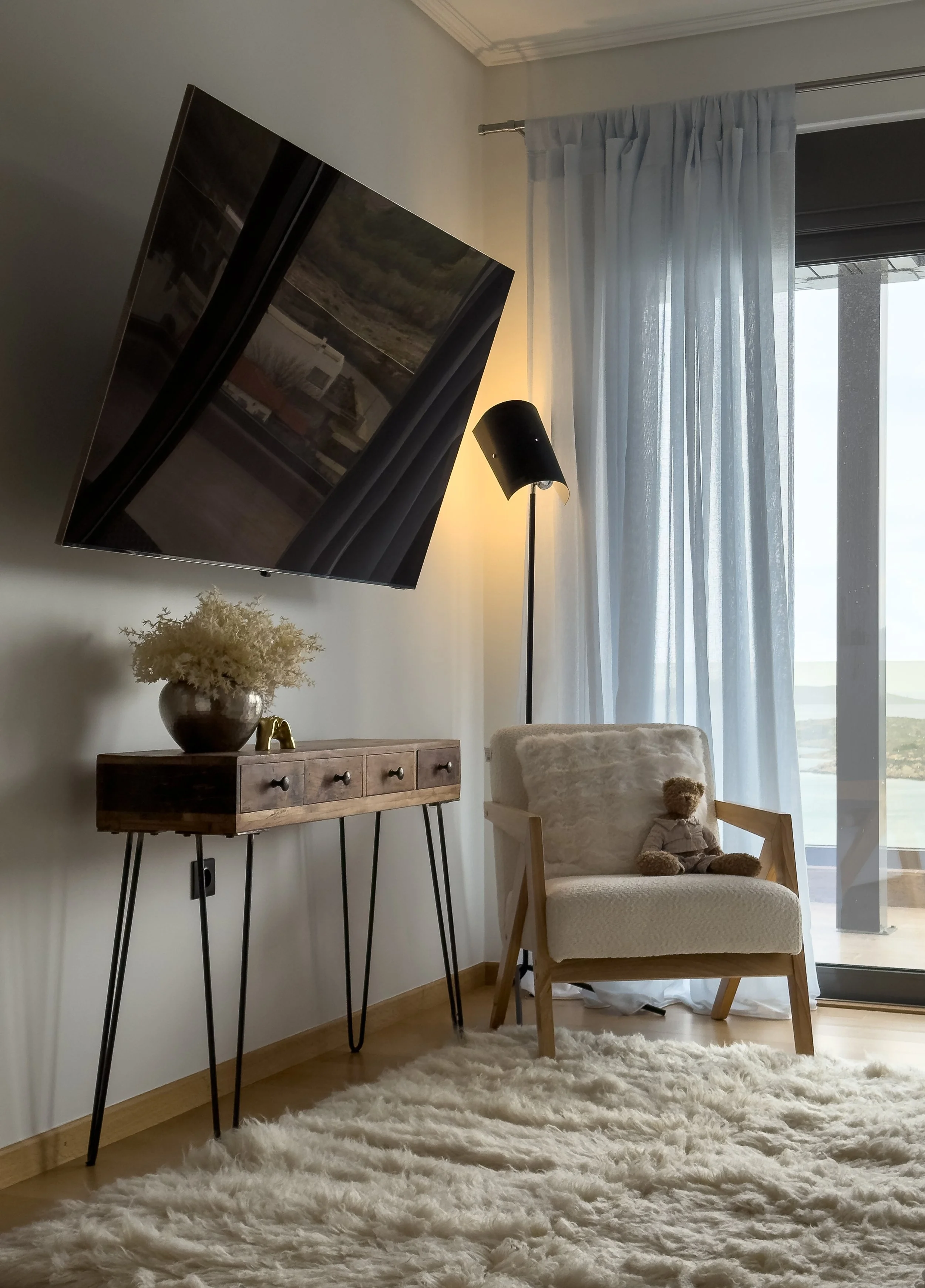 Refined living interiors with natural textures, curated décor and effortless indoor-outdoor atmosphere at Astraea Villa.