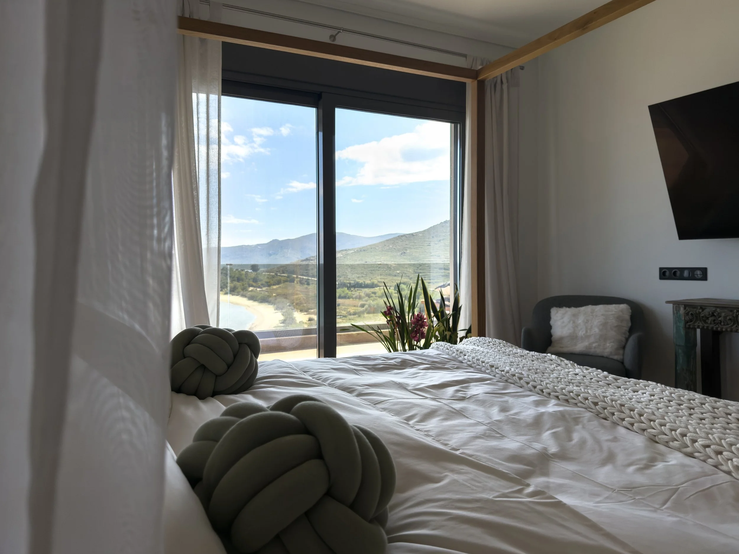 Bedroom spaces designed around openness, stillness and connection to the landscape at Astraea Villa.