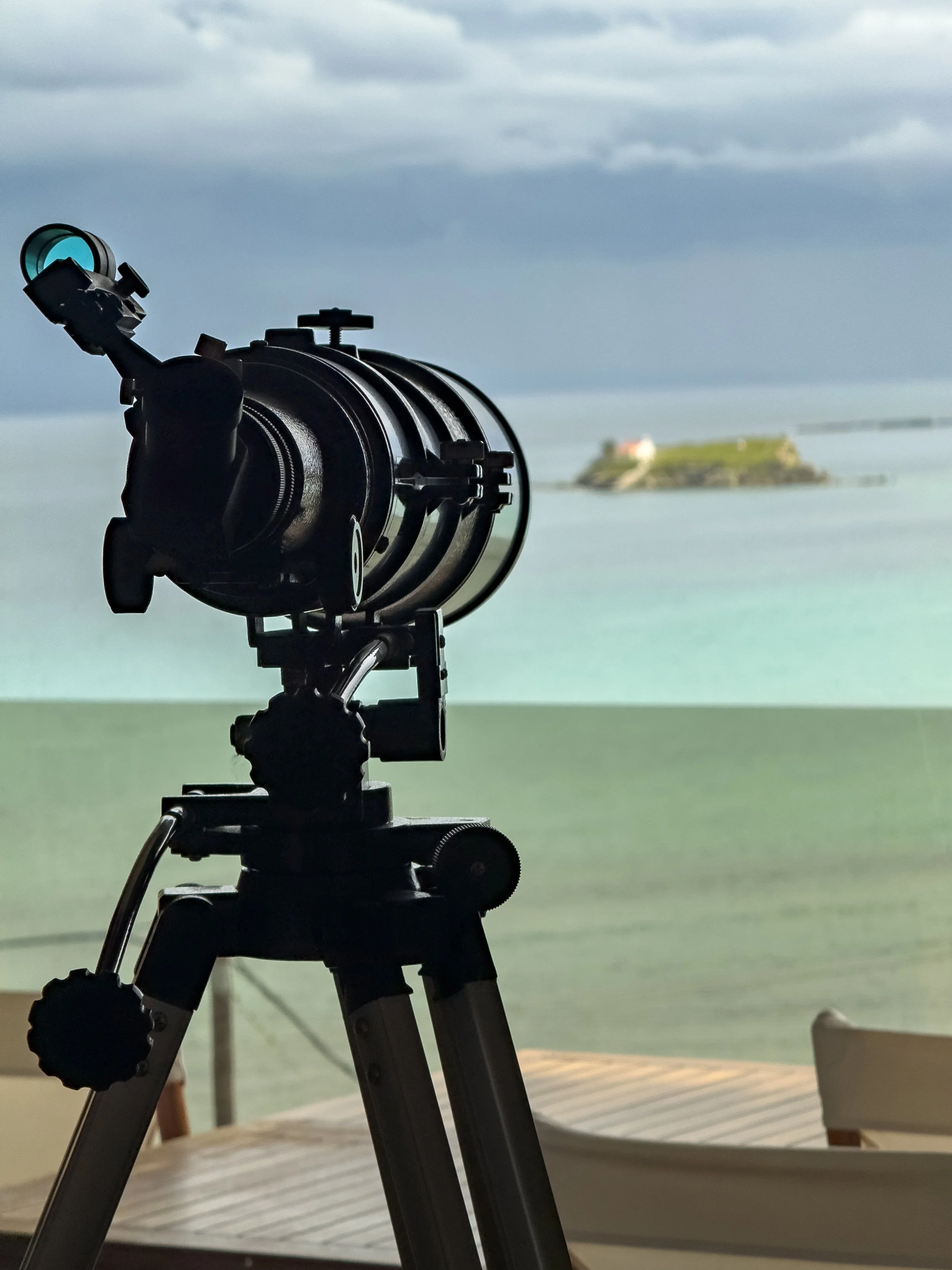 Telescope overlooking panoramic sea and island views at Astraea Villa.