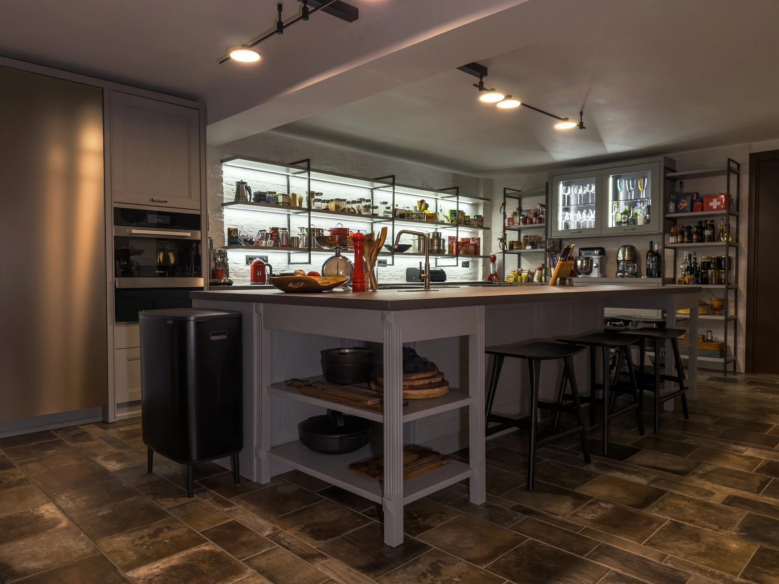 Modern kitchen interiors with layered materials, curated culinary details and refined contemporary character at Astraea Villa.