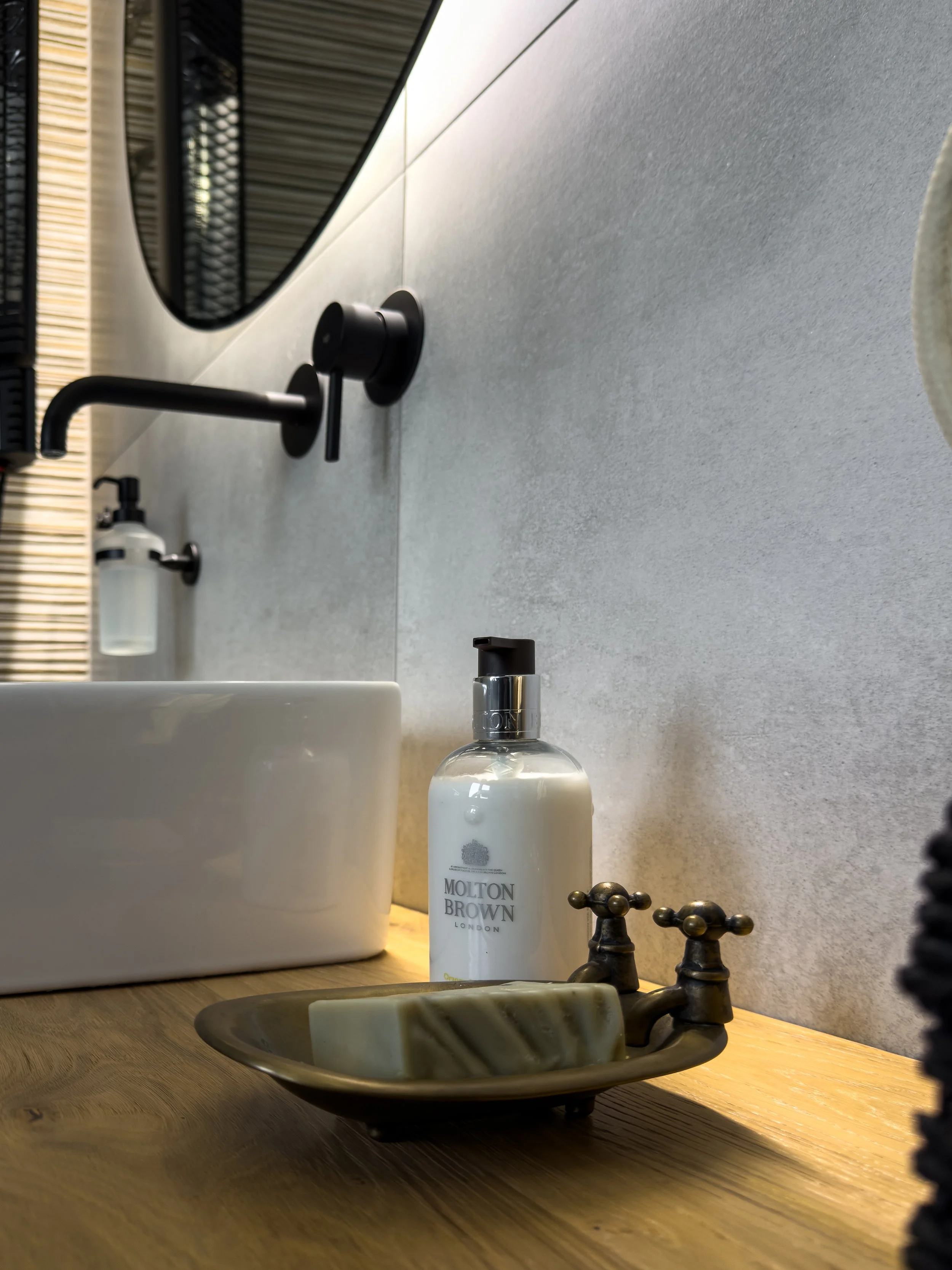 Bathroom interiors inspired by tactile materials and elevated everyday rituals at Astraea Villa.