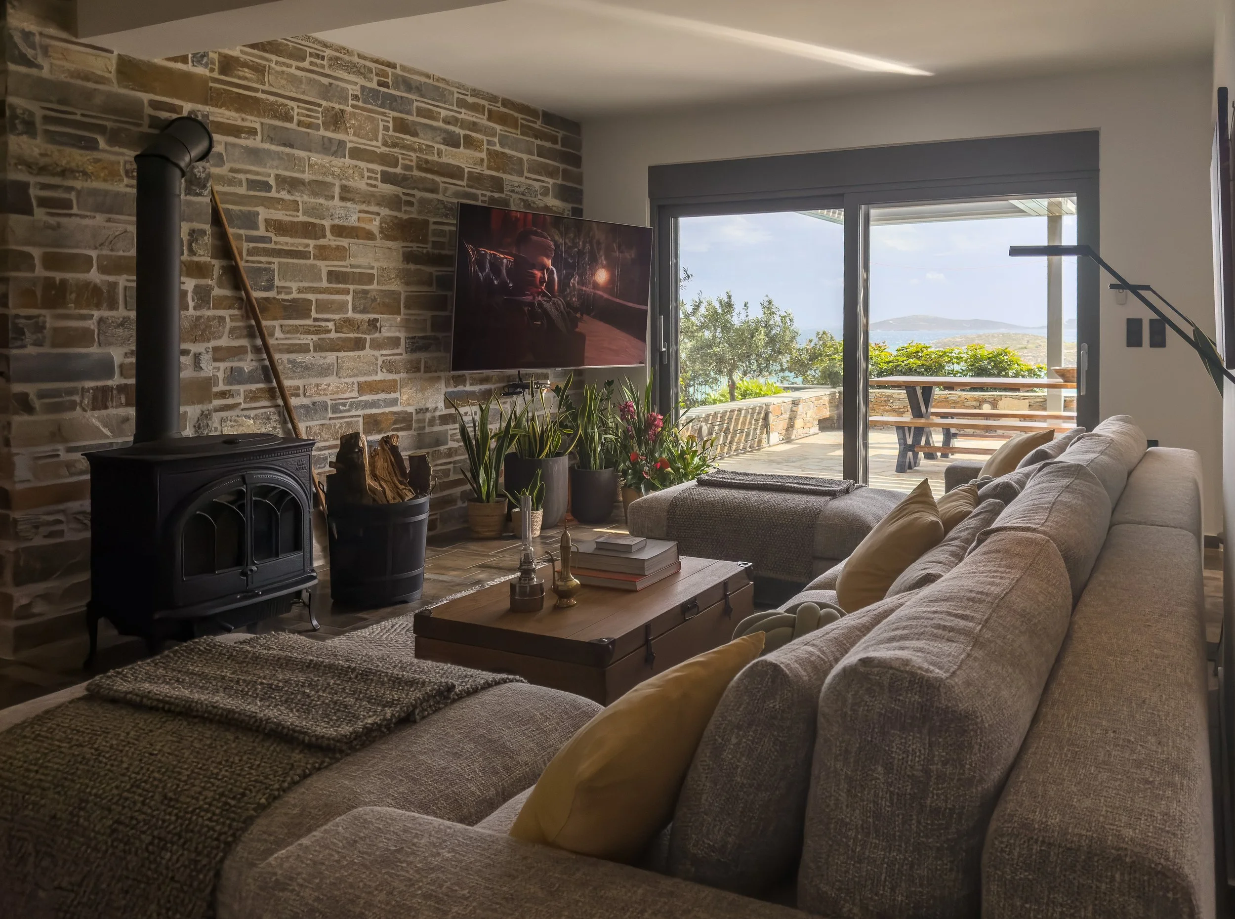 Interior living spaces shaped by warmth, openness and the rhythm of natural living at Astraea Villa.