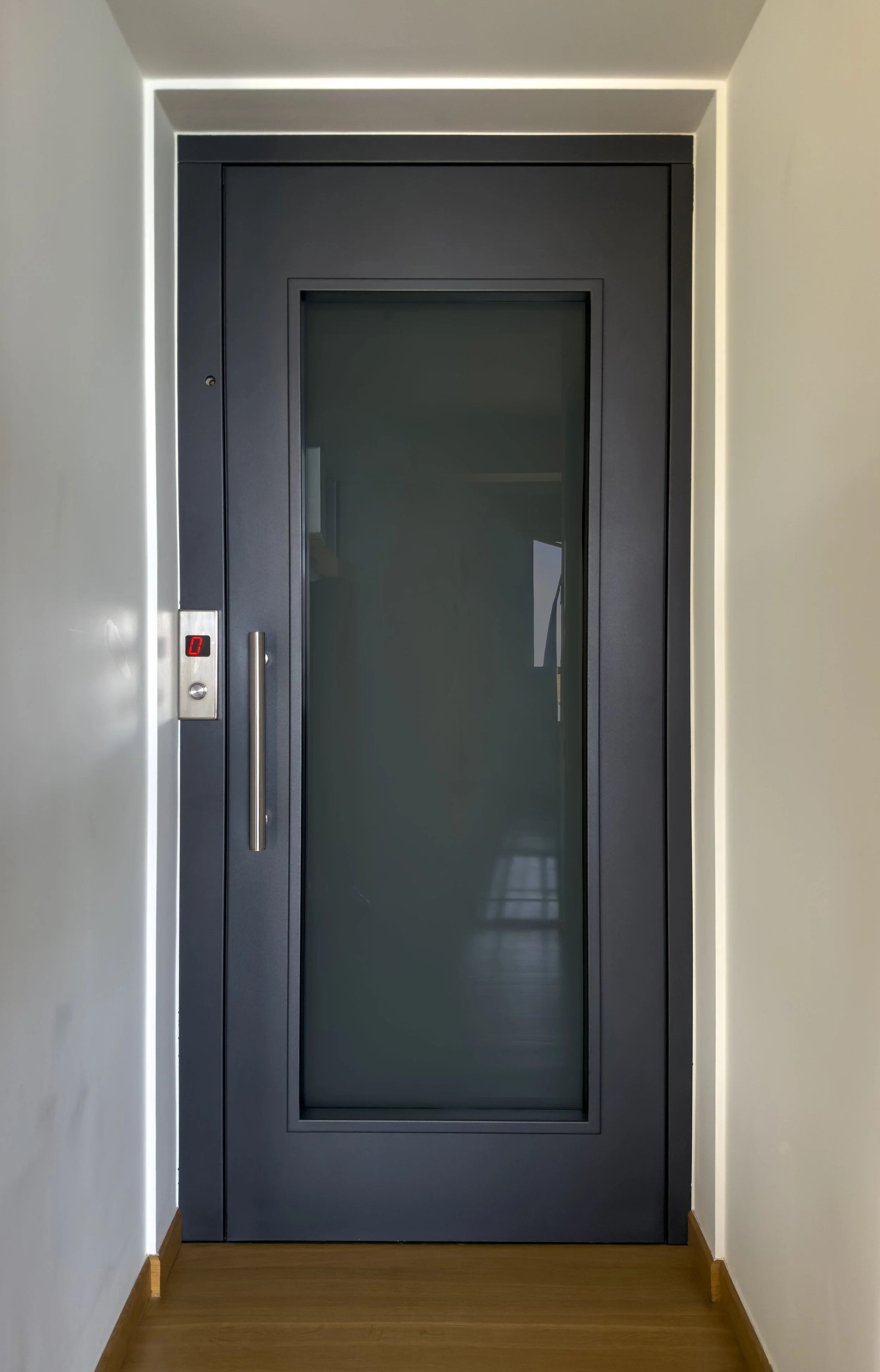 Minimal interior corridor with elevator access and refined contemporary simplicity at Astraea Villa.