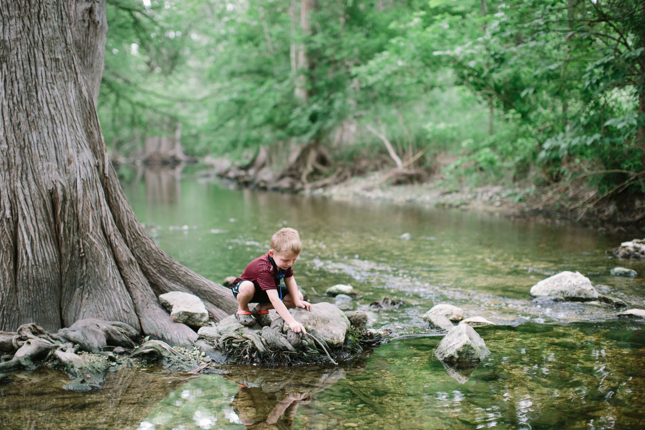Kid exploring the creek