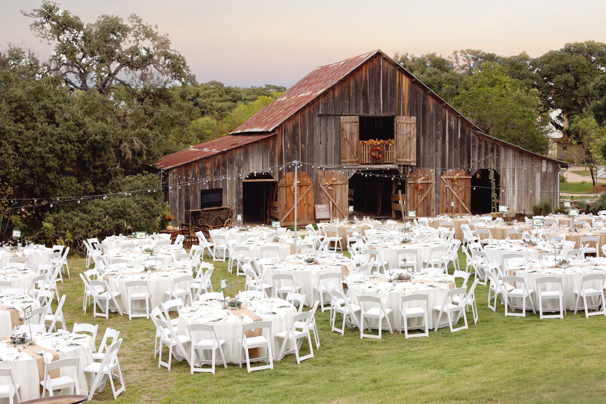 Historic Barn & Lawn staged with round tables