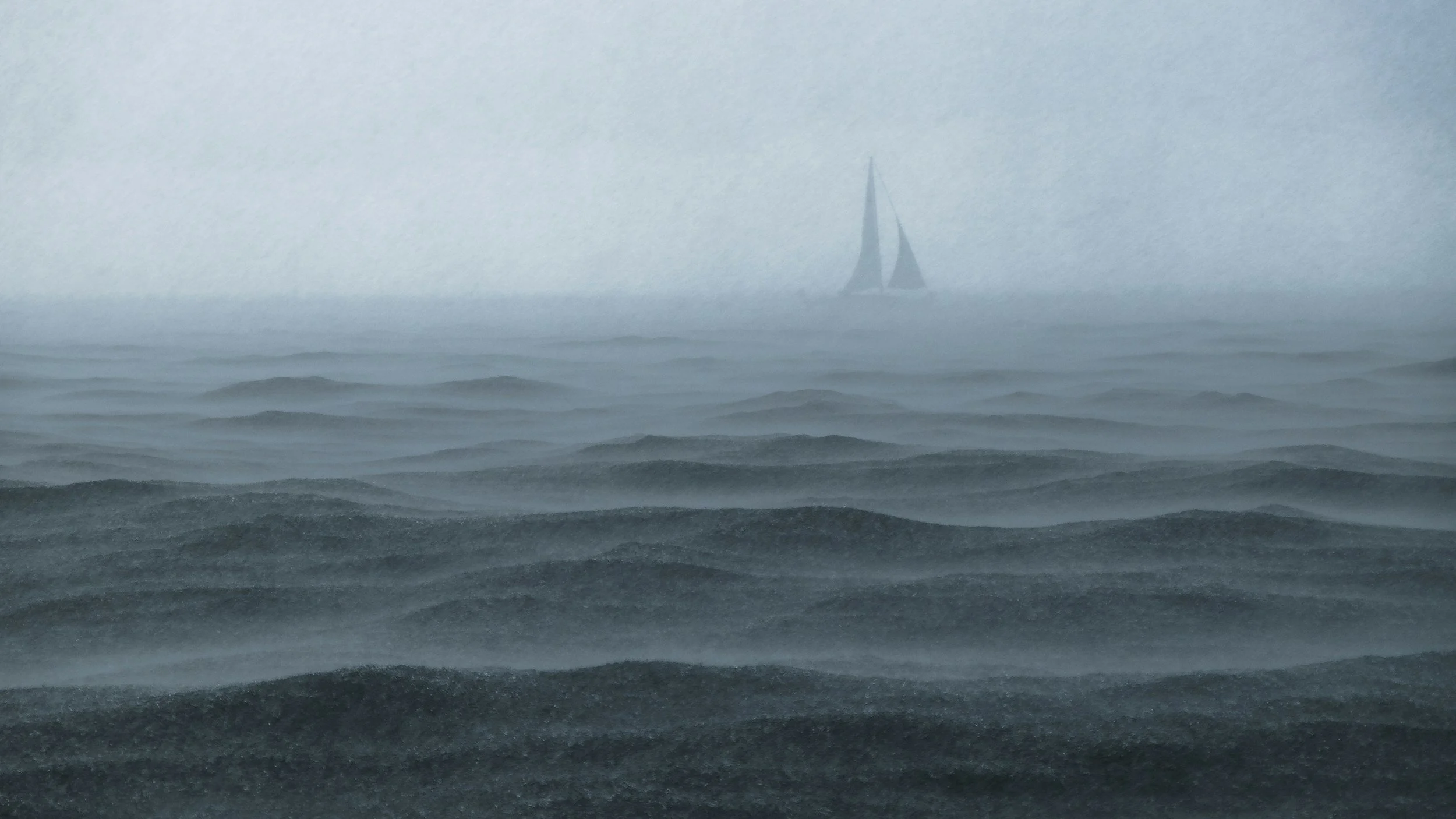 Un voilier naviguant dans une mer agitée sous un ciel brumeux.
