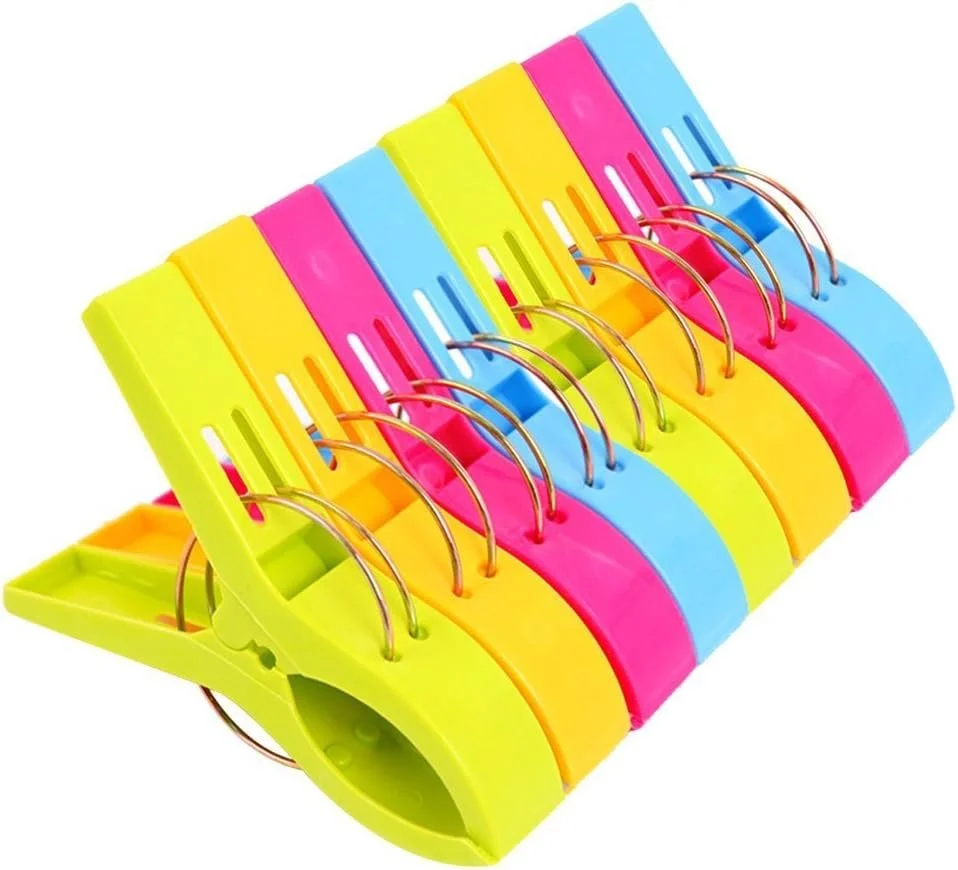 Colorful sticky note organizer with sections in yellow, pink, blue, and green, equipped with metal rings to hold note sheets.