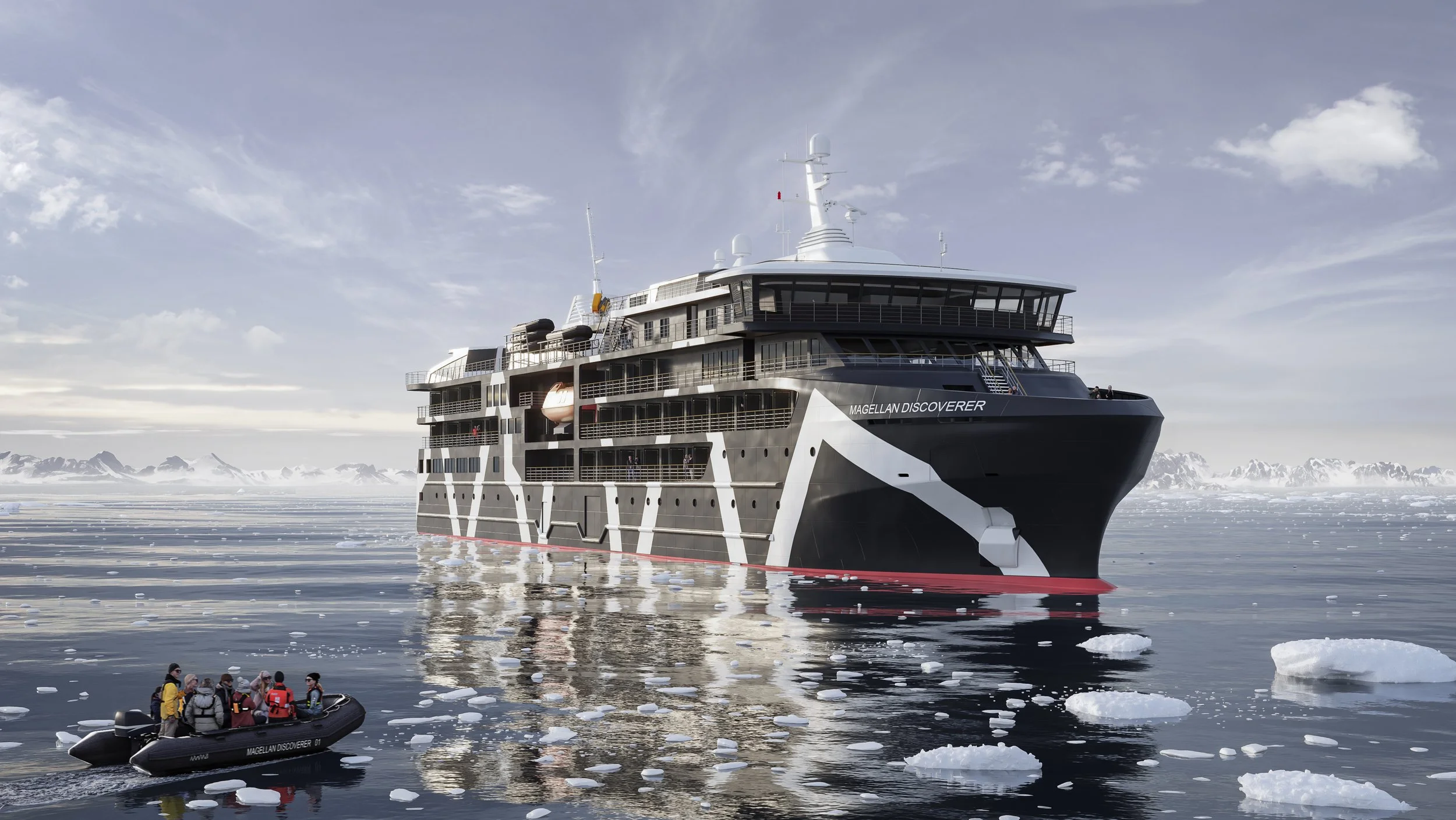 Large luxury expedition cruise ship named 'Magellan Discoverer' sailing in icy waters with mountains in the background, with a small inflatable boat carrying tourists nearby.