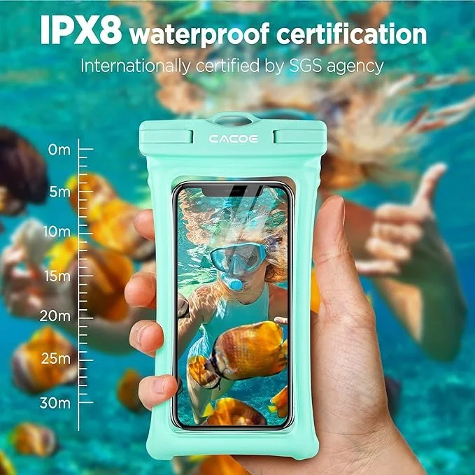 A waterproof phone case with IPX8 certification, shown in a teal color, held in a person's hand underwater near swimmers. The case has a built-in ruler on the side for depth measurement and a phone inside taking a selfie of a swimmer with a diving mask and colorful fish.