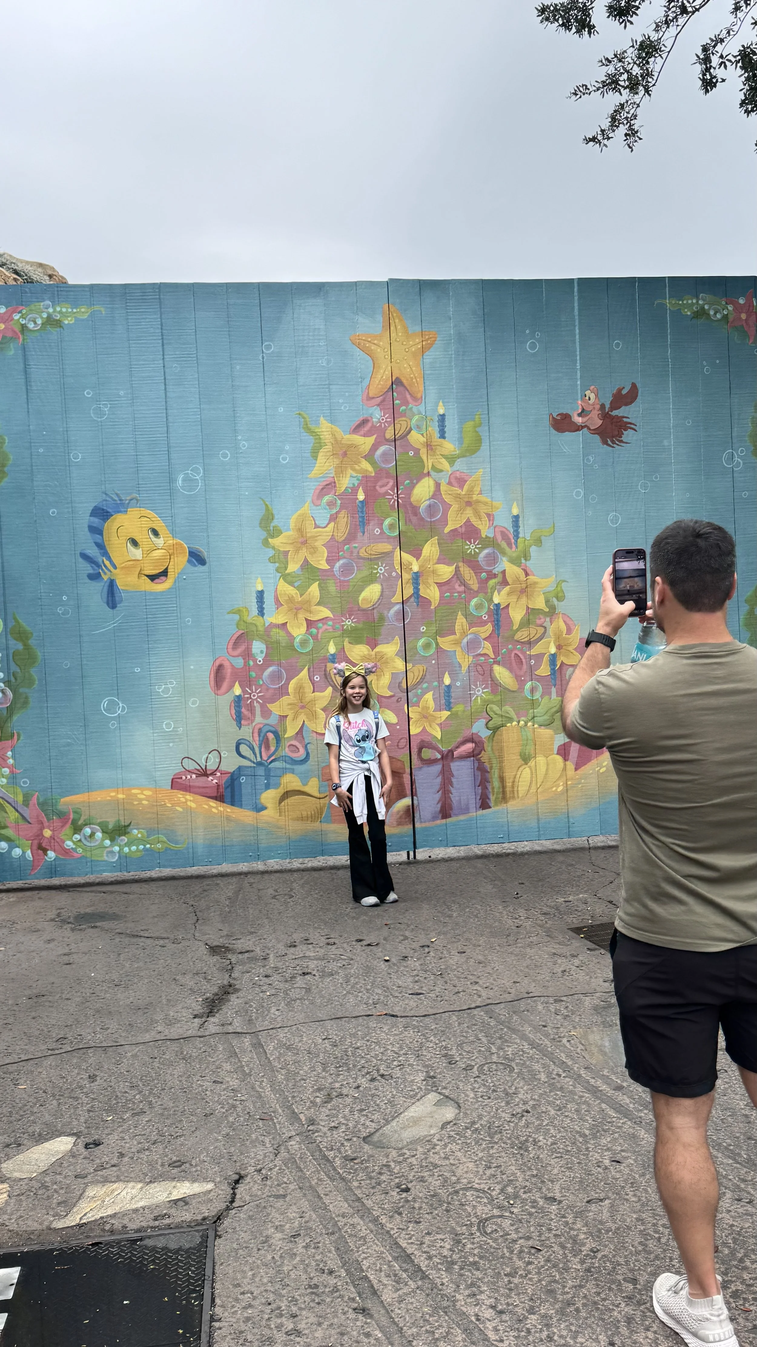 Joy and Benton (aka the Photographer) at the cutest Christmas painting near Storybook Circus