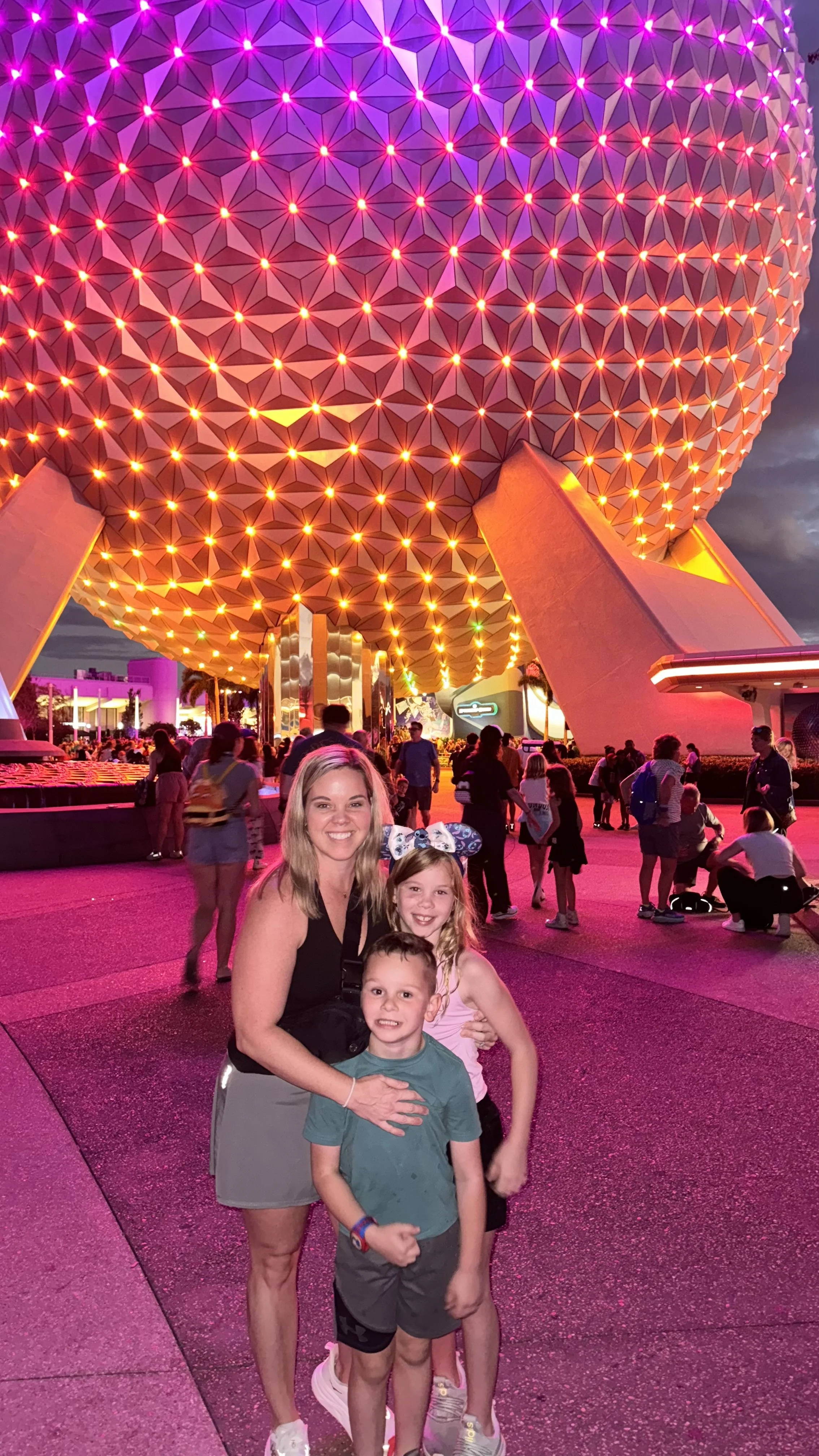 Morgan and the girls with the Epcot ball all lit up at night!