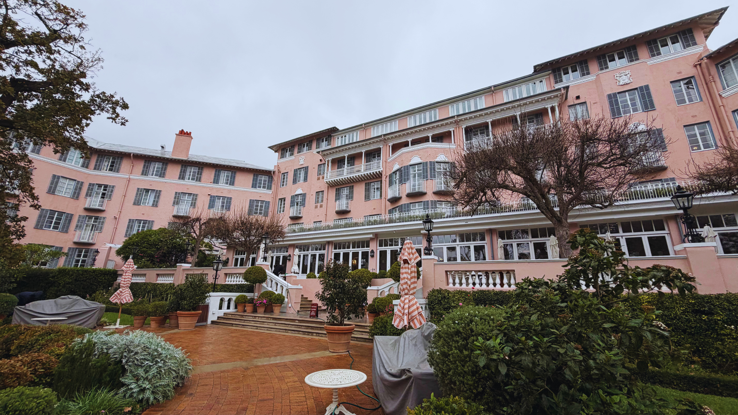 Pink facade of Belmond Mount Nelson with Table Mountain behind
