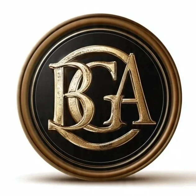 A round black and gold emblem with the initials BJA in gold, stylized with overlapping and decorative font.
