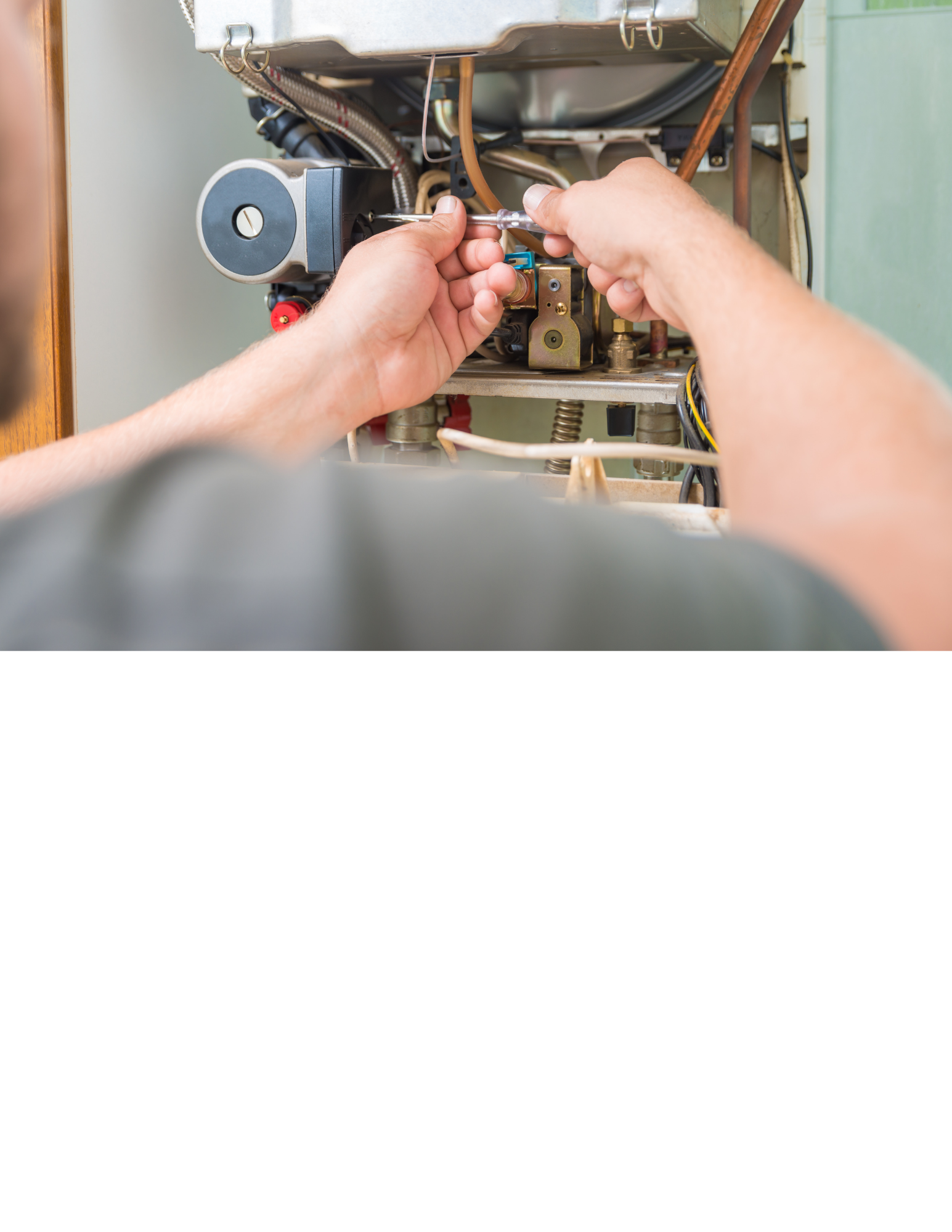 A person repairing or adjusting the internal components of a household dishwasher or similar appliance with a screwdriver.