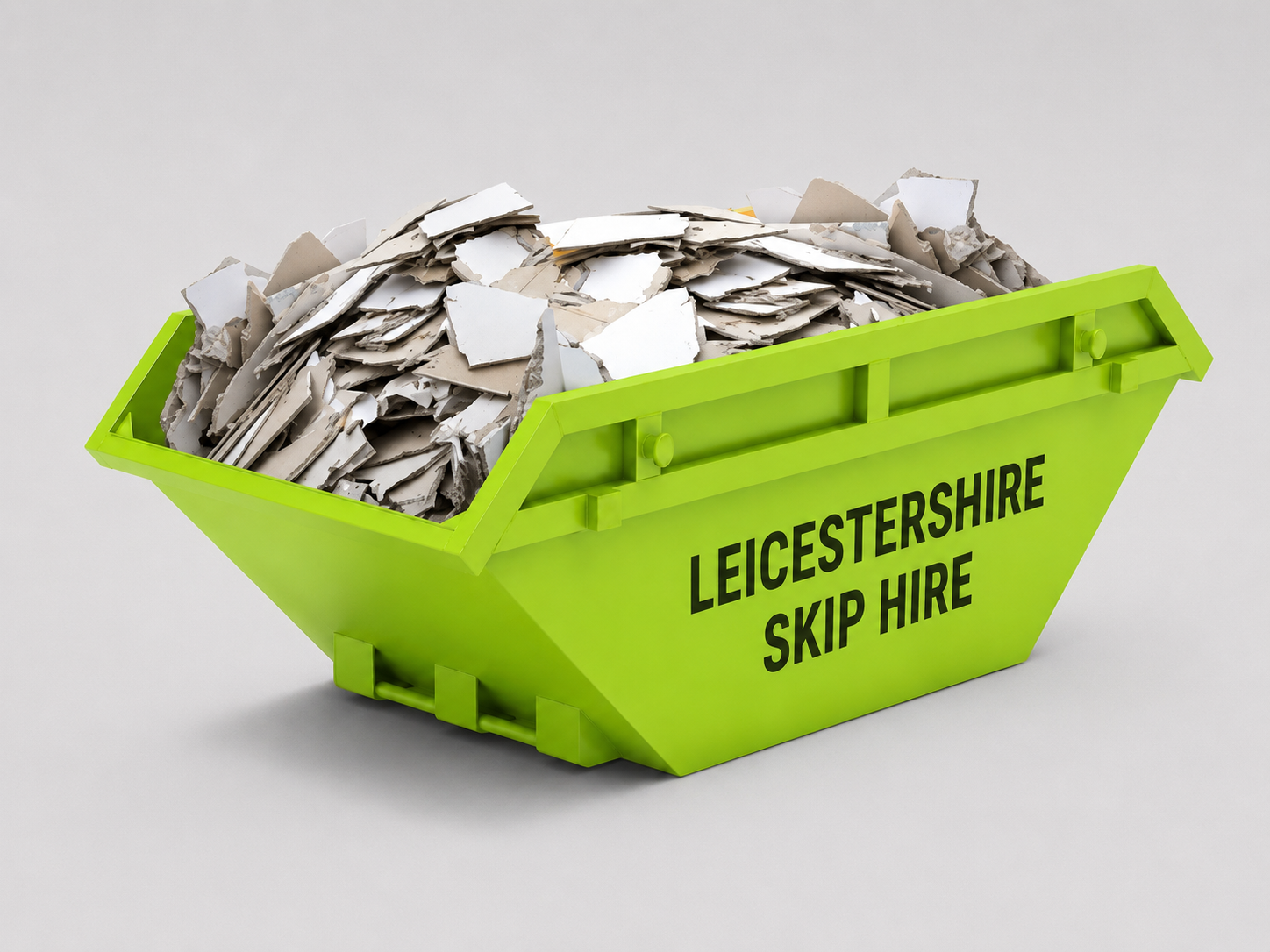Bright green skip bin labeled "Leicestershire Skip Hire" filled with torn and crumpled papers.