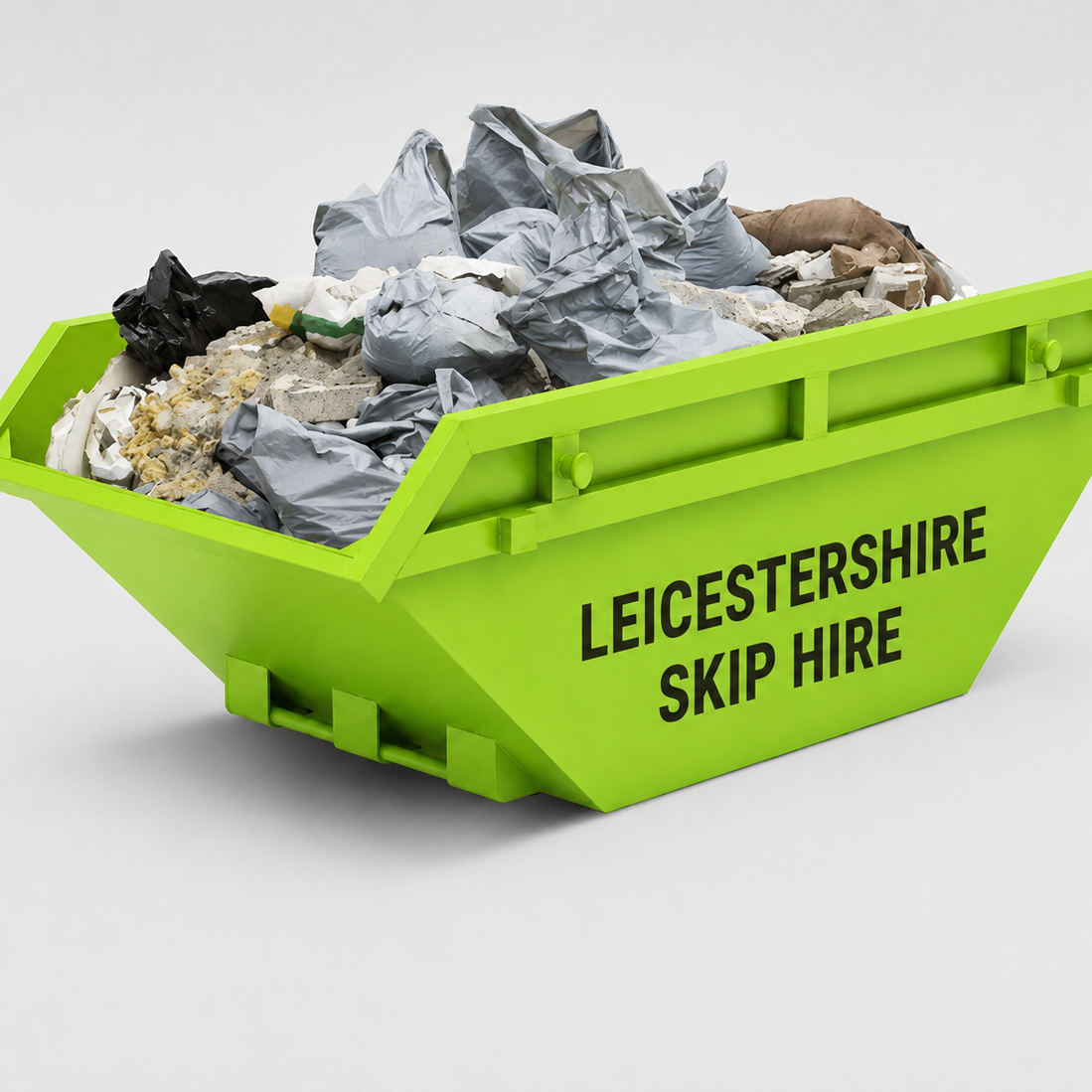 Bright green skip hire bin filled with construction debris, including crumpled paper, bricks, and rubble, with 'LEICESTERSHIRE SKIP HIRE' written on the side.