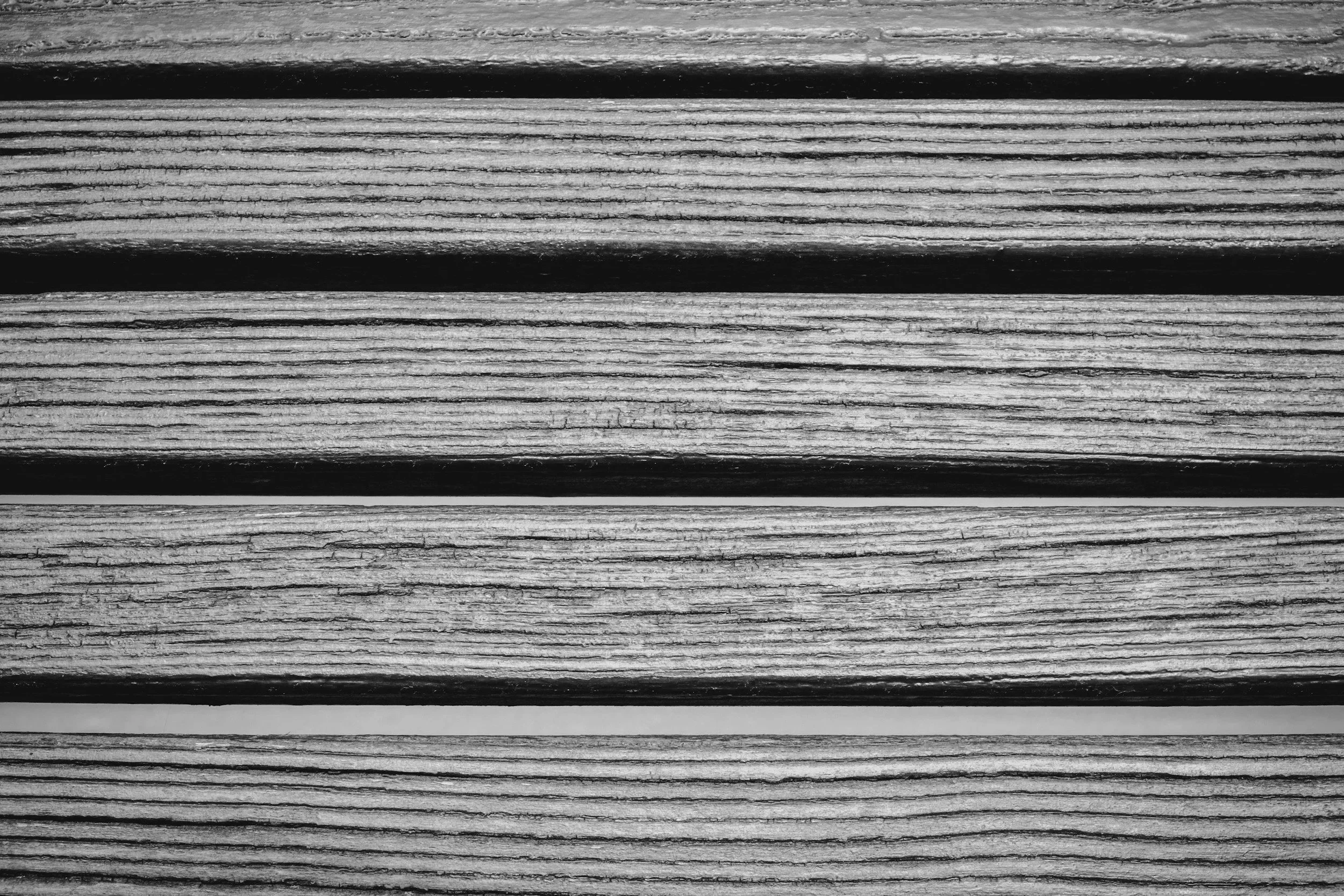 Industrial hemp fiber used as a composite feedstock for engineered construction materials