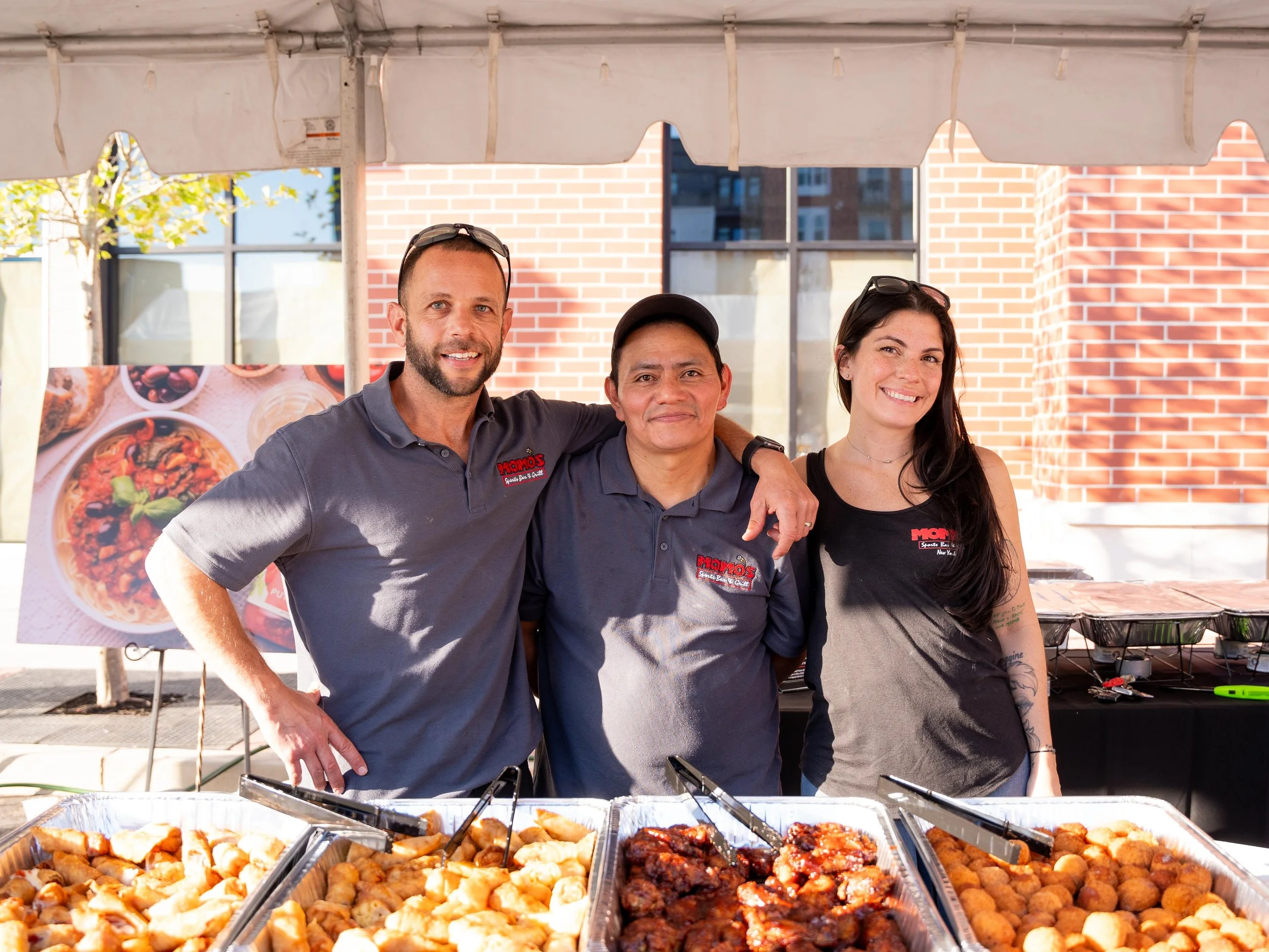 Momo's Vendor Staff In Front of Food