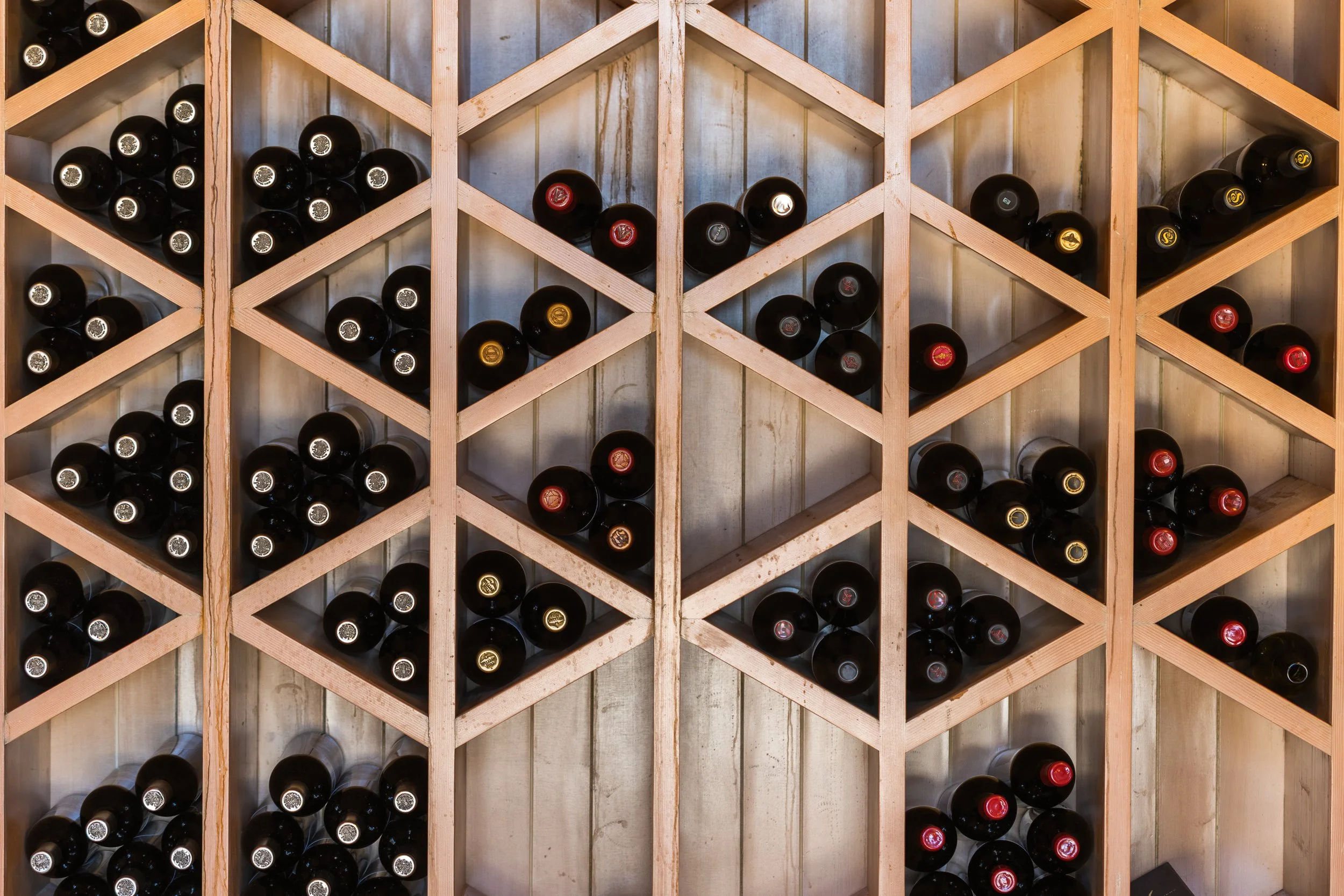Bottles of wine in a wall rack