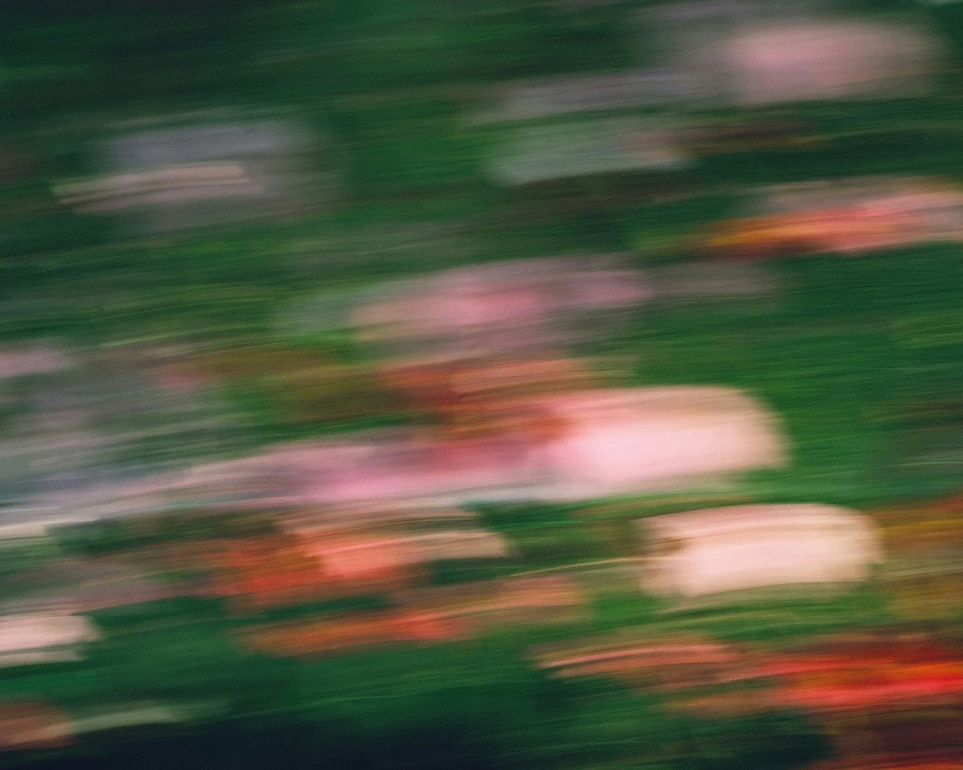 Blurred image with streaks of green, pink, white, and red colors.AS9100 ITAR manufacturer North Carolina