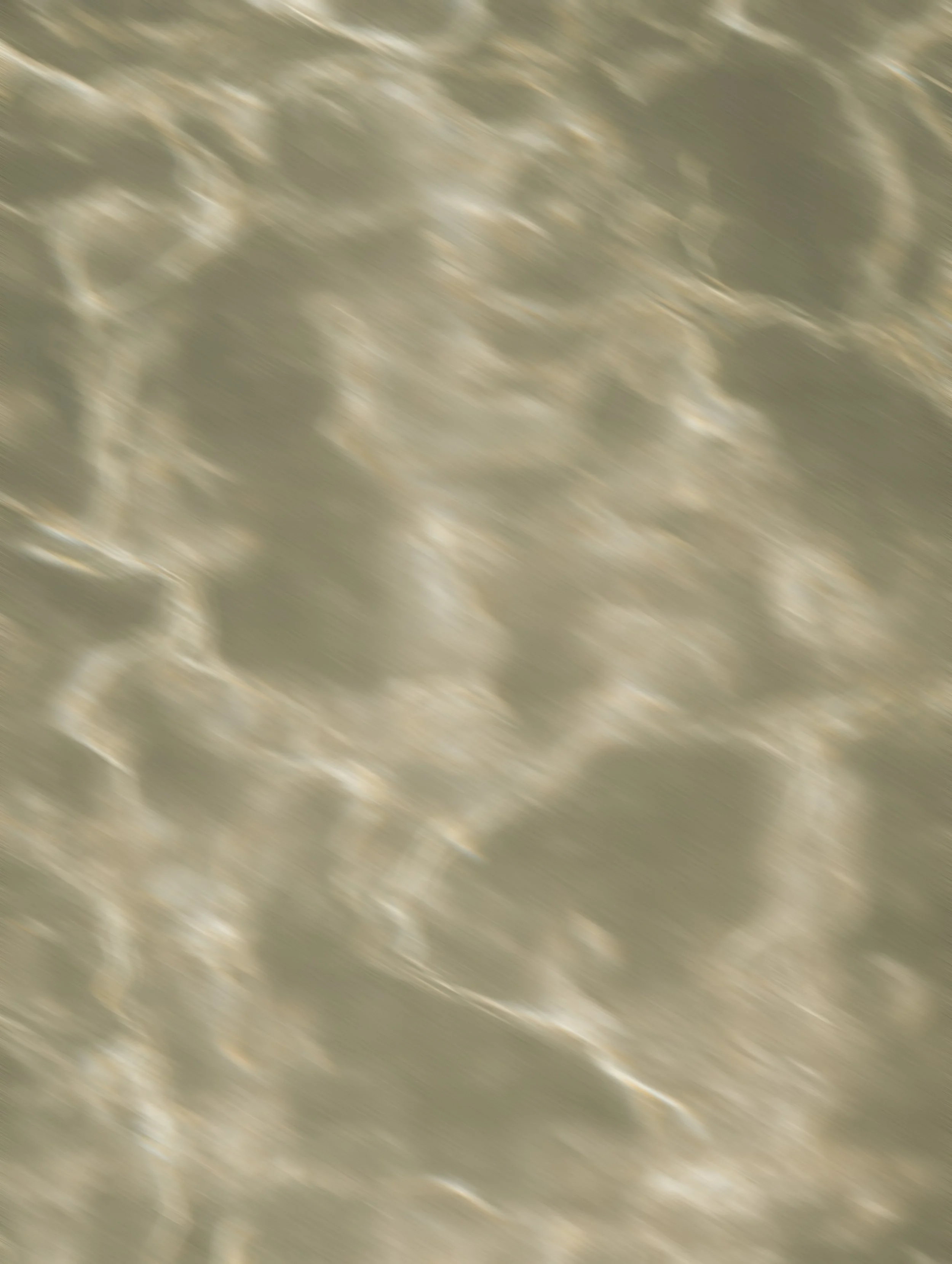 Blurred view of a metallic surface with a diamond plate pattern.