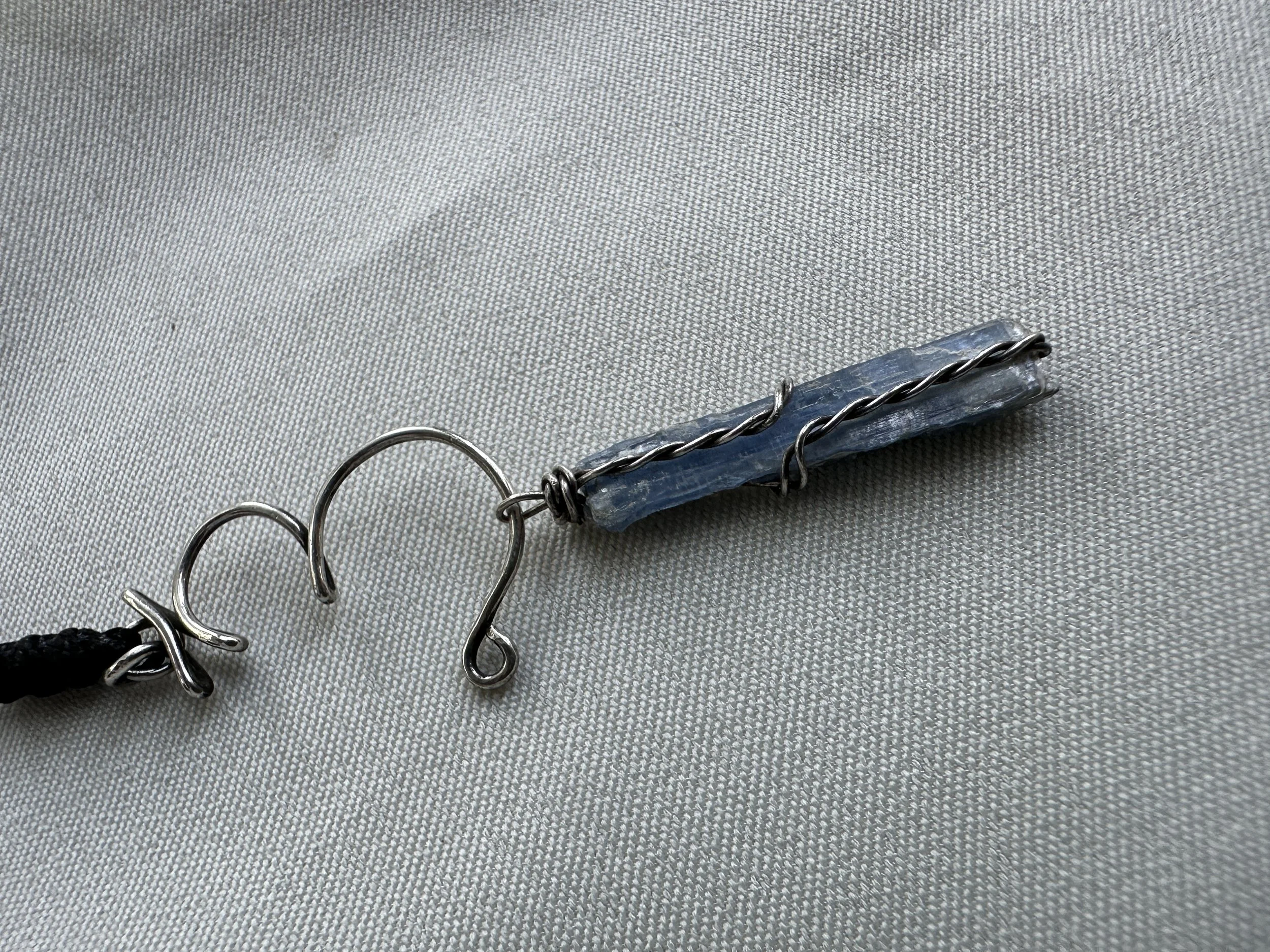 blue-kyanite-wire-wrapped-necklace-chakra-symbol.JPG