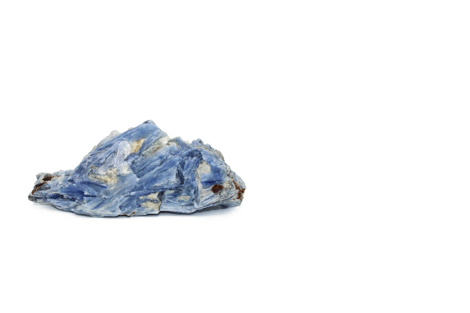 A raw blue mineral or rock on a white background.