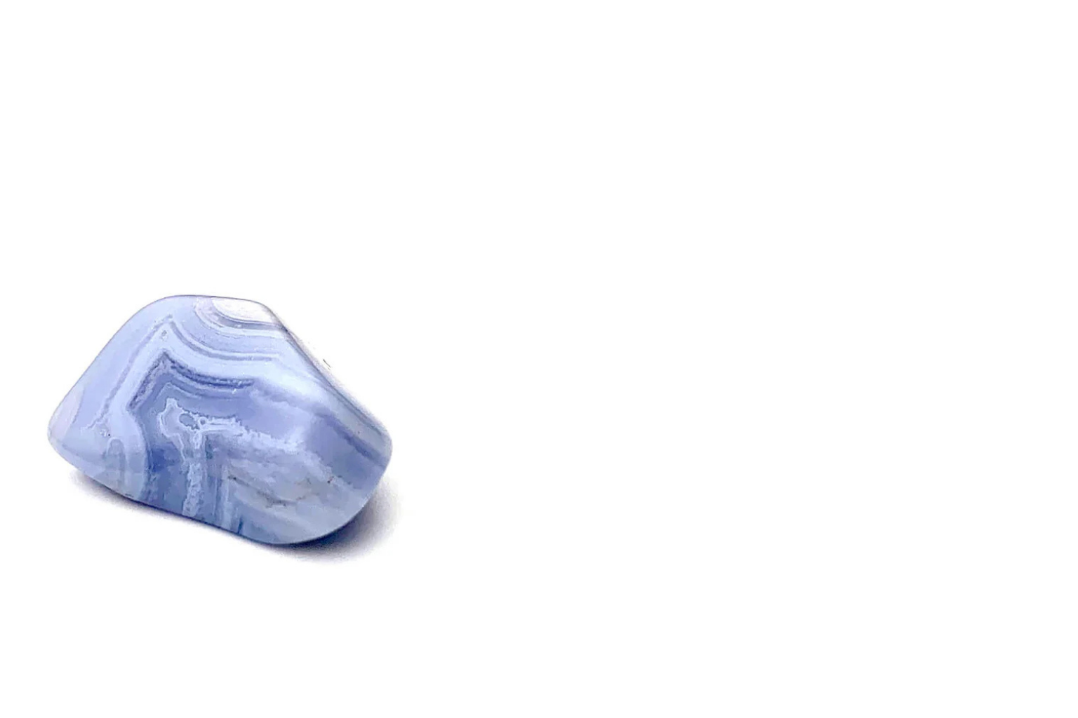 A polished blue lace agate on a white background.