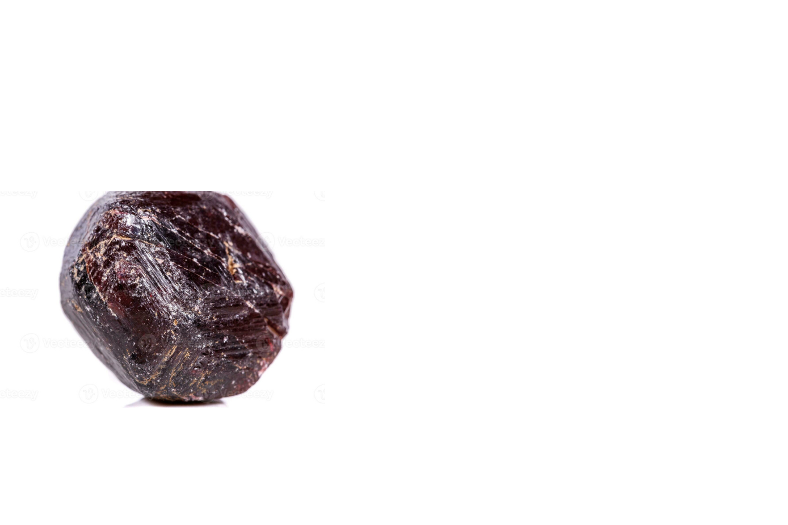 Close-up of a raw, uncut black diamond isolated on a white background.