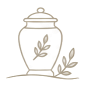 Decorative glass jar with a lid, containing a plant and surrounded by leaves, on a white background.