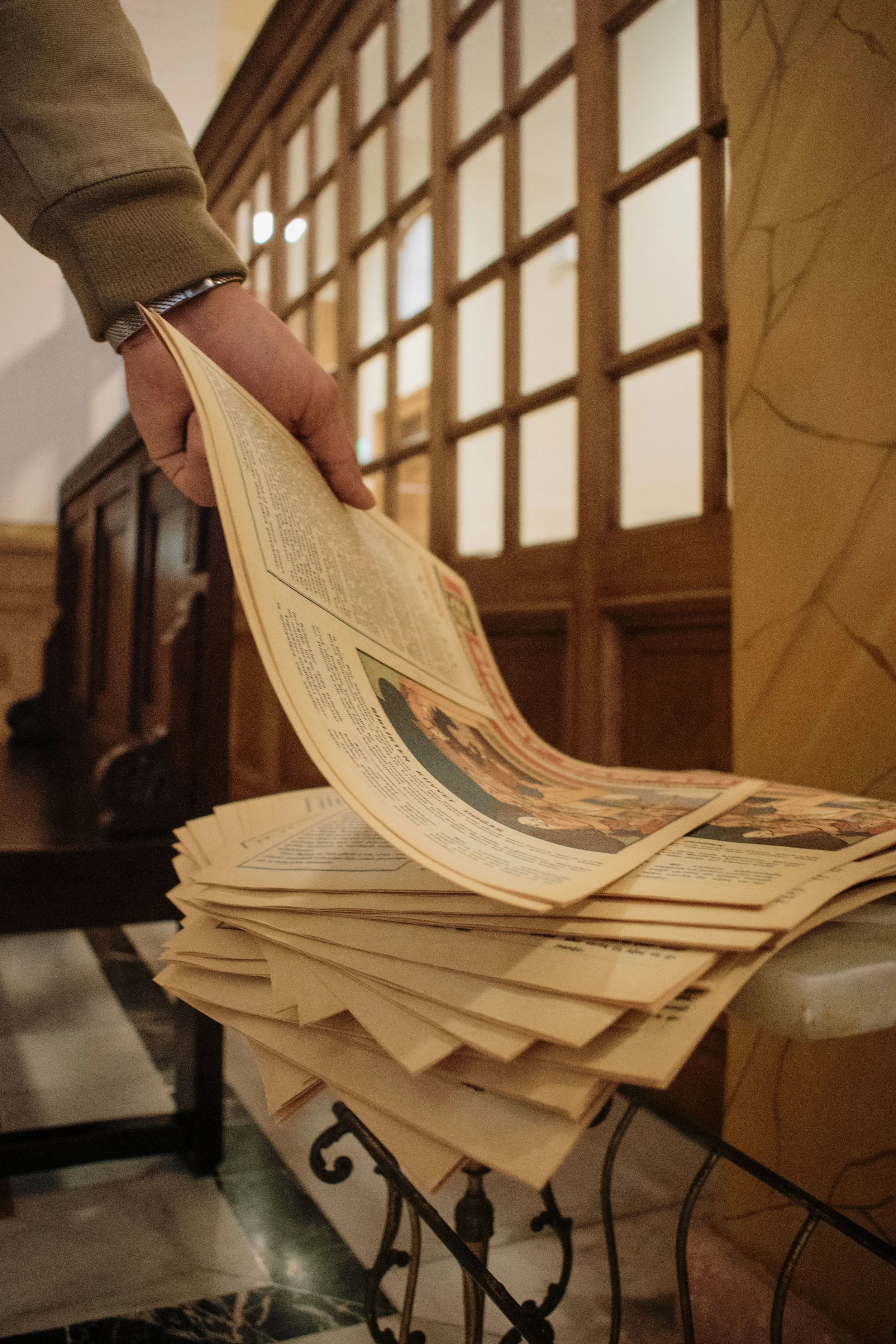 Image of a person reading a newspaper