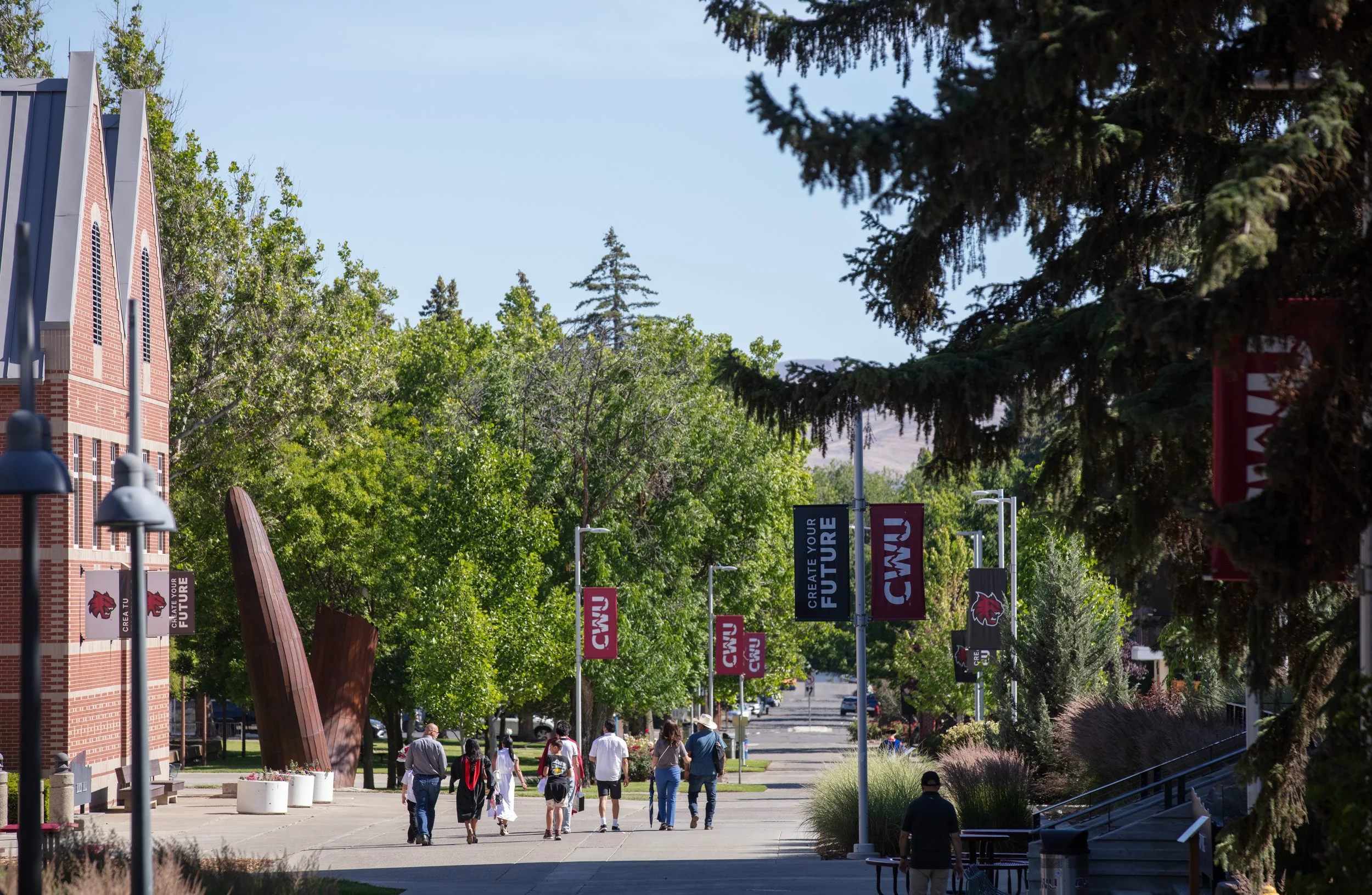 Photo of people walking on Central Washington University's Campus. Credit: CWU Flickr.