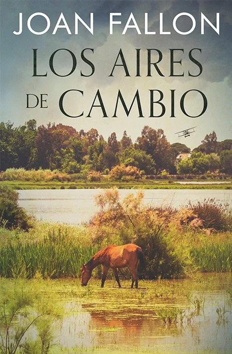 Book cover for Los Aires de Cambio by Joan fallon showing a lagoon in Doñana and a horse.