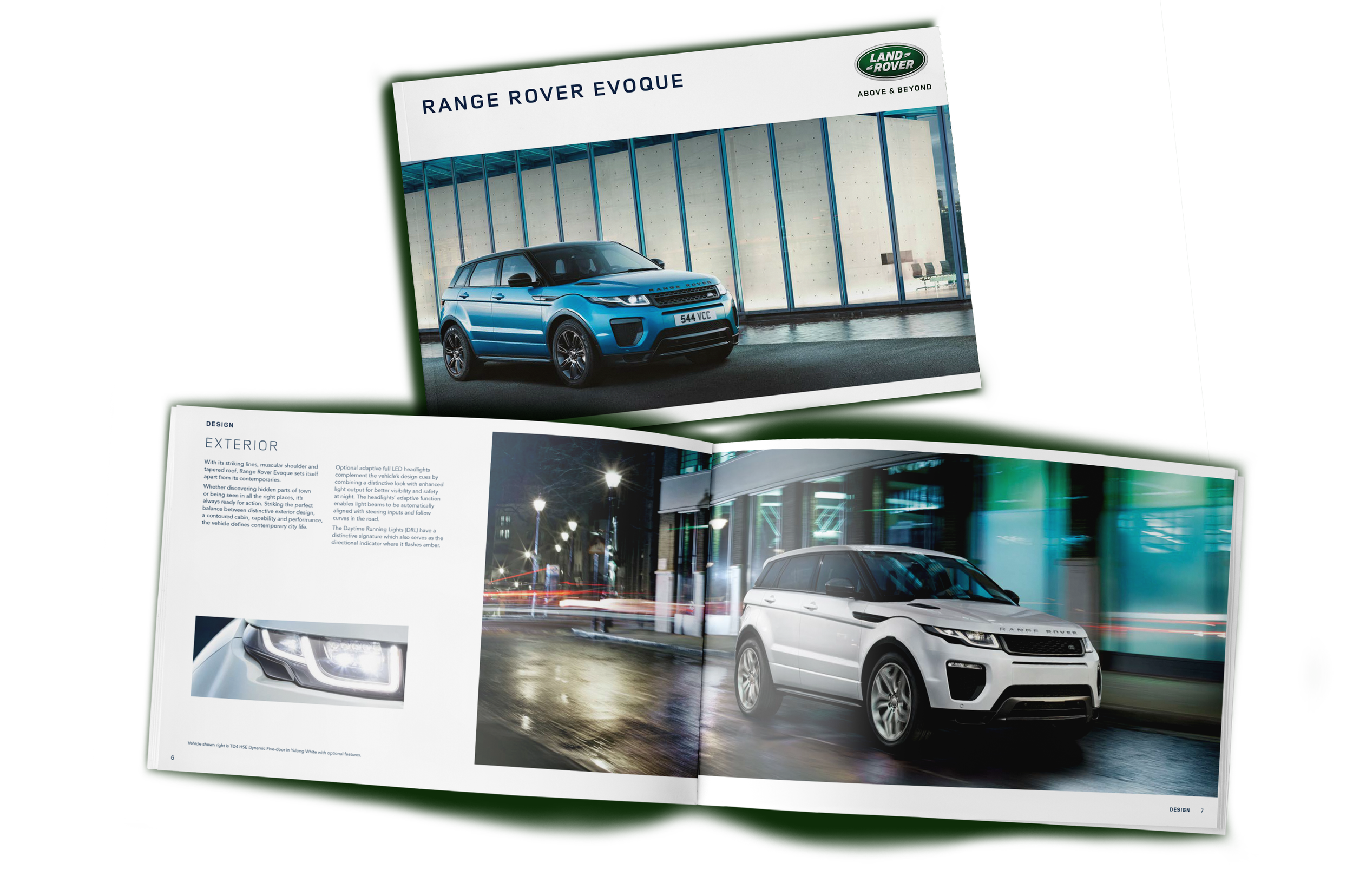 An open car brochure featuring two Range Rover vehicles,