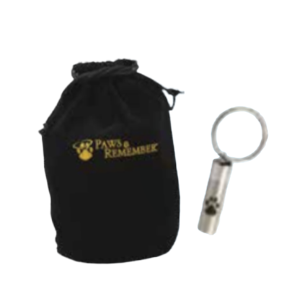 A black drawstring pouch with yellow text and logo reading "Paws Remembers" and a small metallic keychain with a paw print design.
