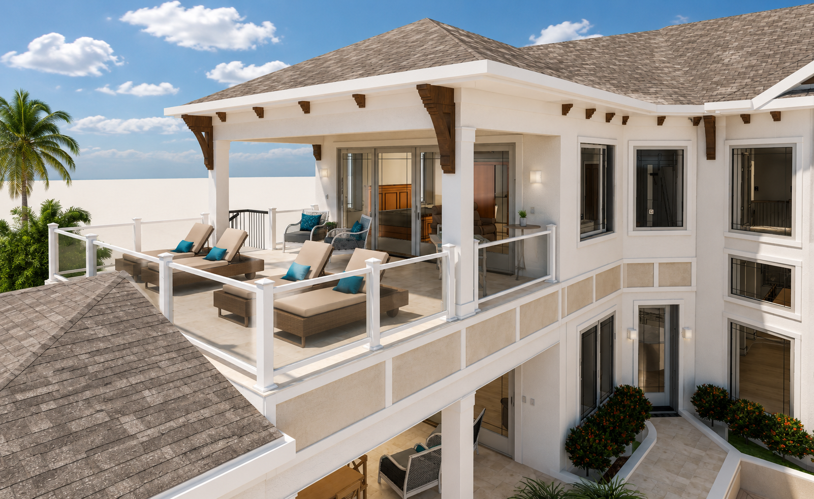 A spacious upper balcony with outdoor furniture, including sun loungers and chairs, overlooking a garden with palm trees, part of a modern multi-story house with large windows and sliding glass doors, set against a blue sky with clouds.
