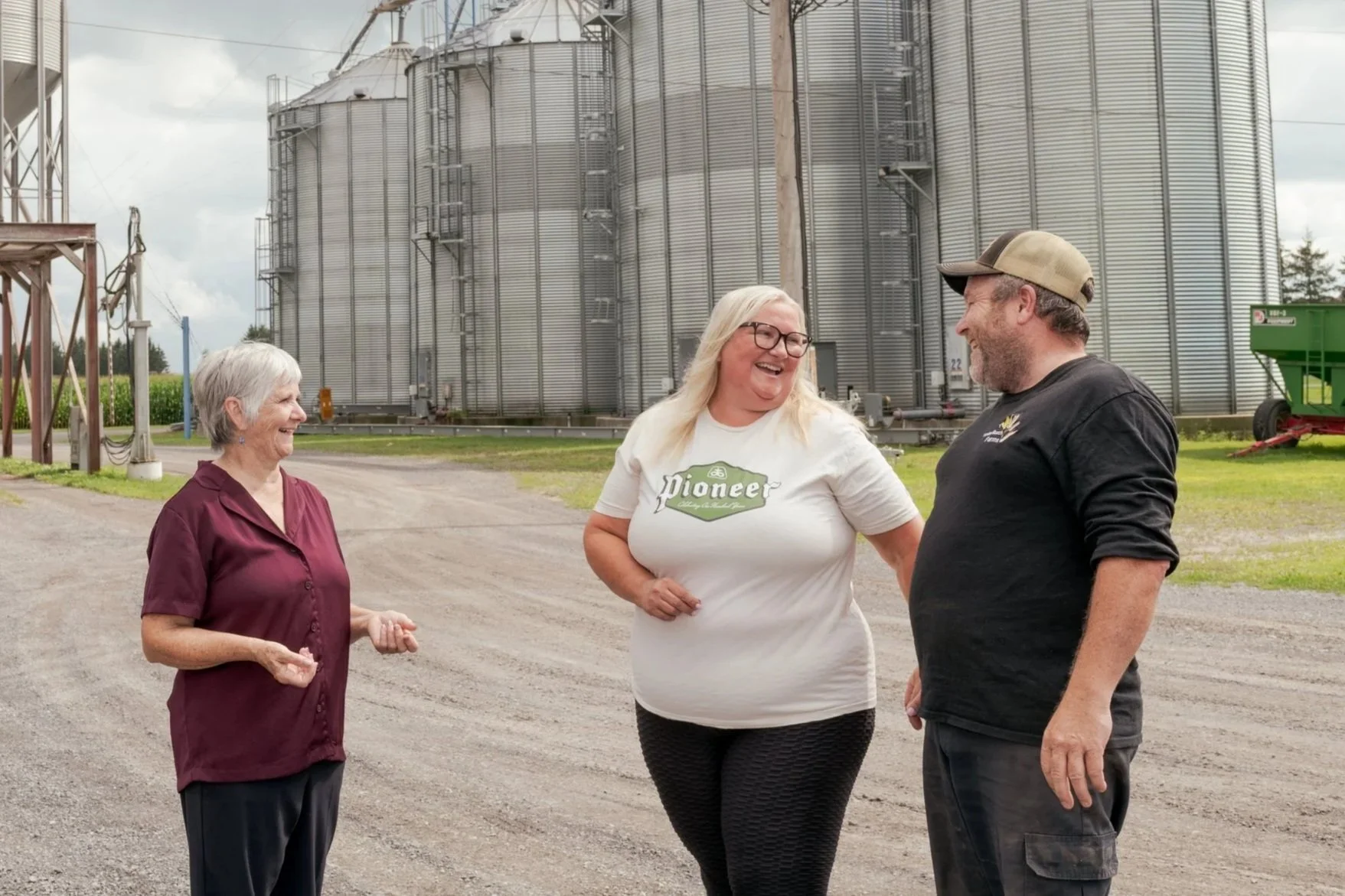 Theresa Bergeron having a discussion with two North Dundas residents on their farm.