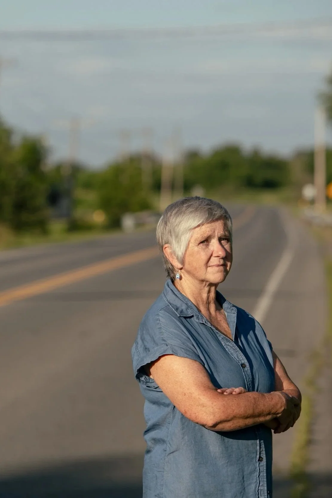 Theresa Bergeron standing on a rural road.