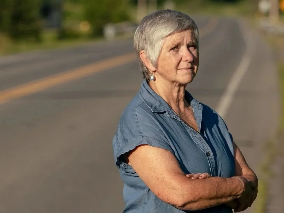 Theresa Bergeron standing on a rural road.