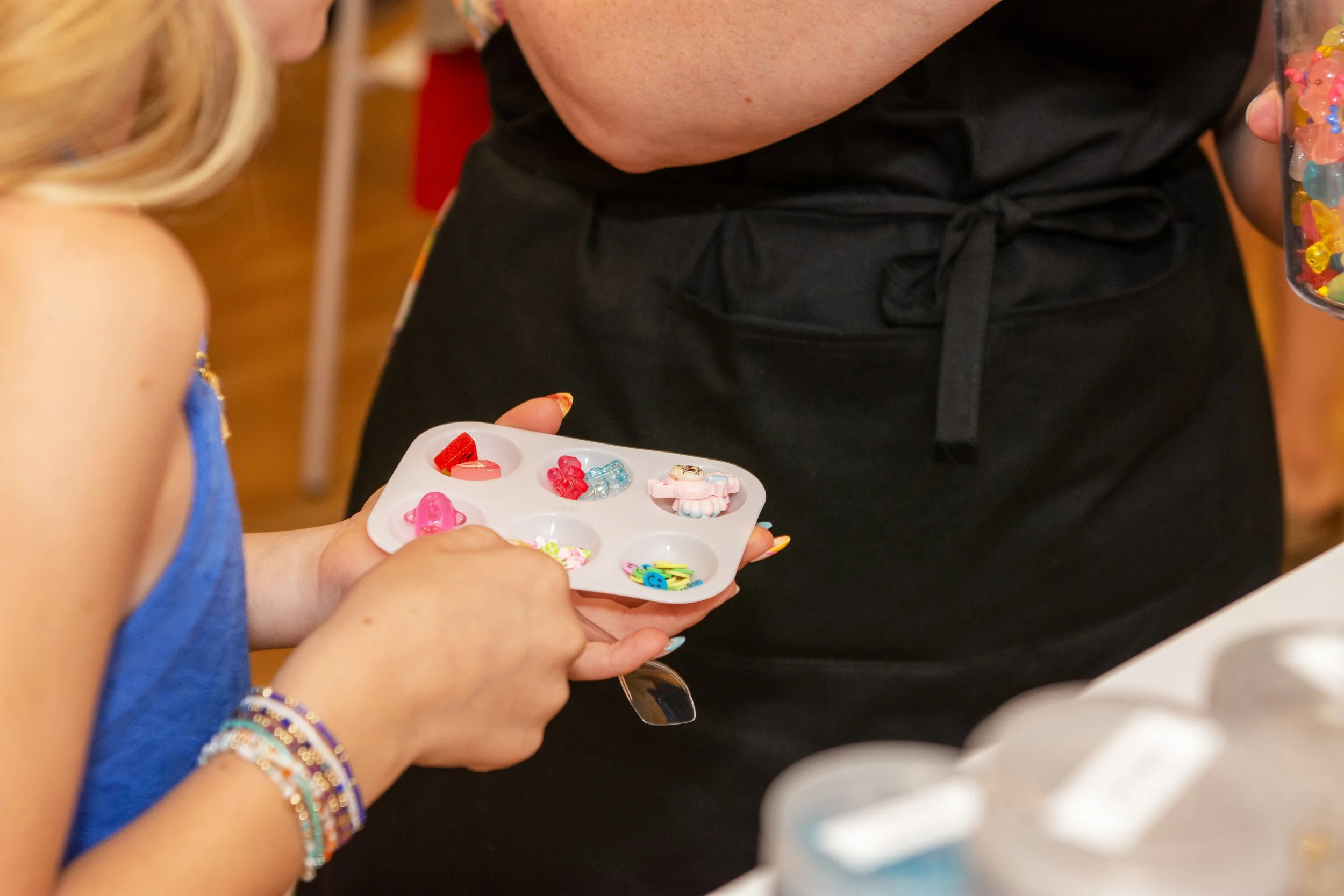 Colorful slime charms and sprinkles at the Mini Makers Charm Bar