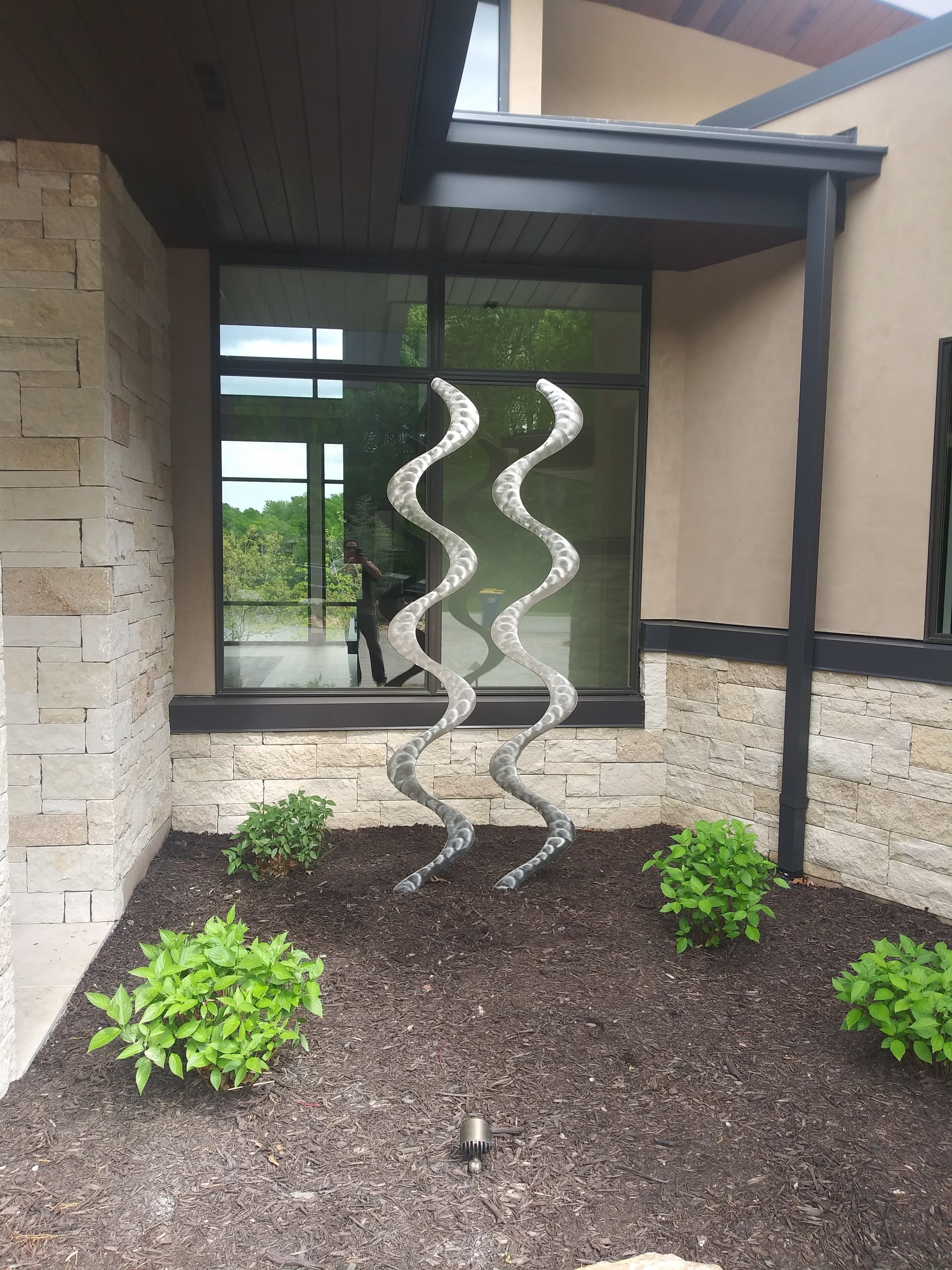 Pacific Northwest metal sculptor Chet Redmon metal sculpture garden art water sculpture fluid motion