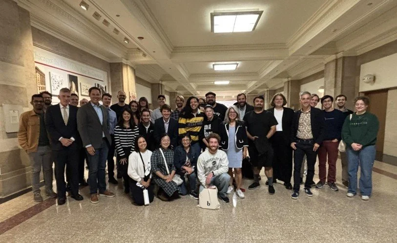 Urbanist volunteers stood in celebration at City Council in October 2025 after the Zoning Committee approved 'upzoning' Broadway in parts of the Uptown and Edgewater neighborhoods.