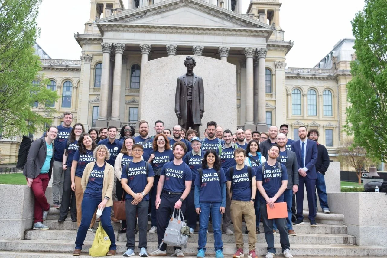 Volunteers from Abundant Housing Illinois standing in front of the Capitol building in Springfield, IL.