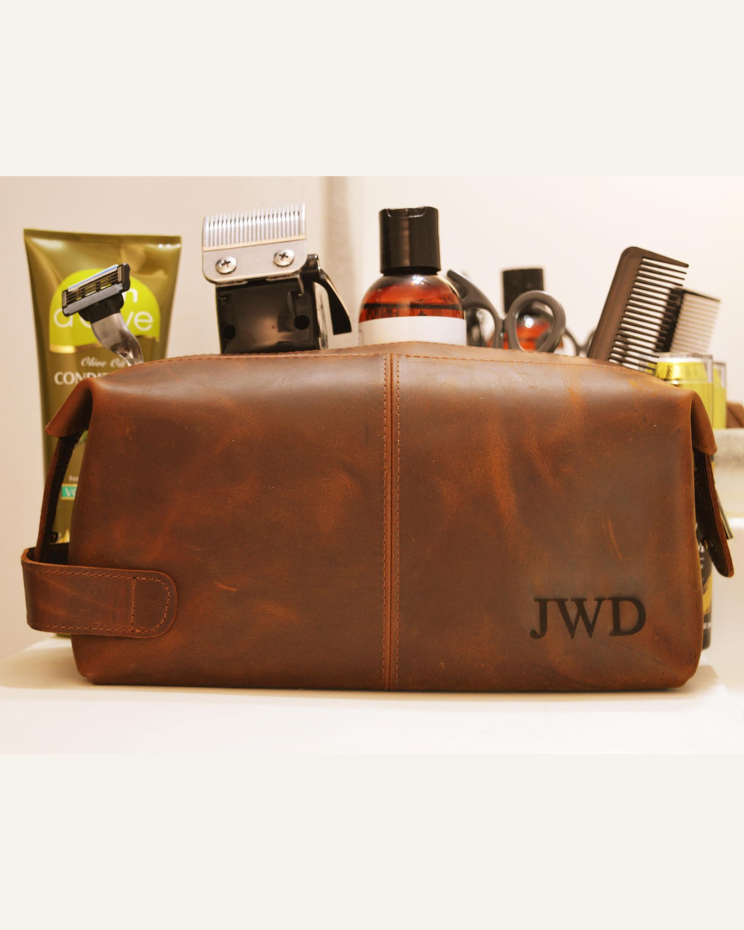 brown leather personalized toiletry bag, comb, shaver, accessories