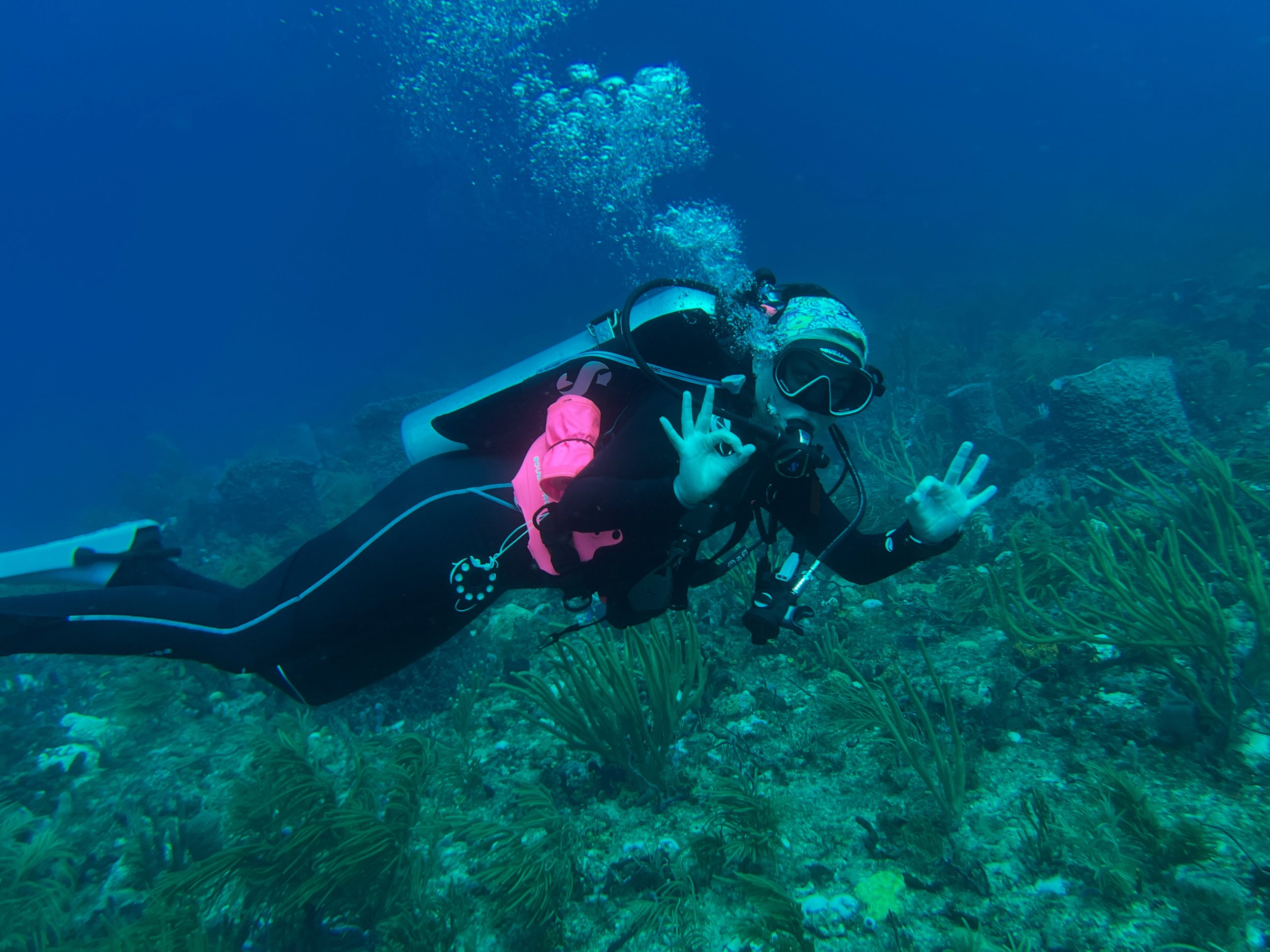 Woman scuba diving underwater
