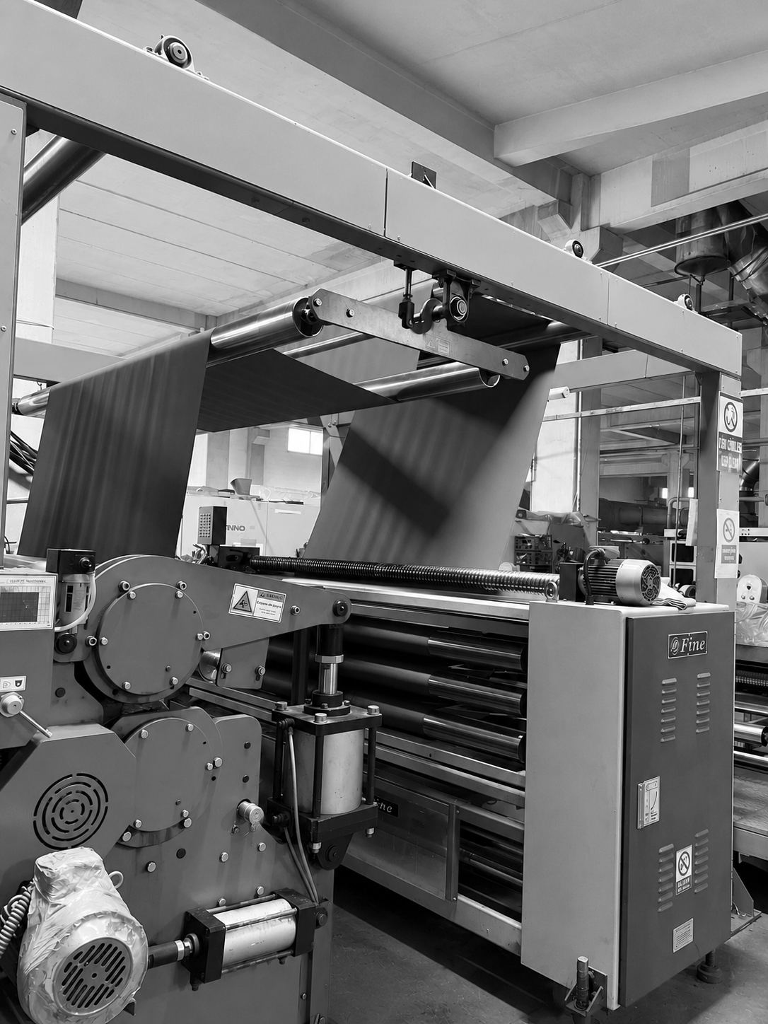 Industrial printing or paper manufacturing machine inside factory