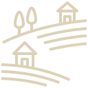 Hilly landscape with three houses and a small building, all on sloped terrain.