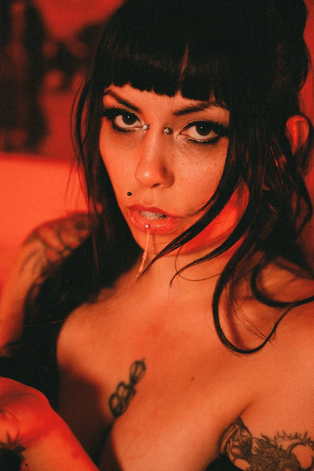 Woman spitting and drooling posing for an erotic photo session in Toronto, ON